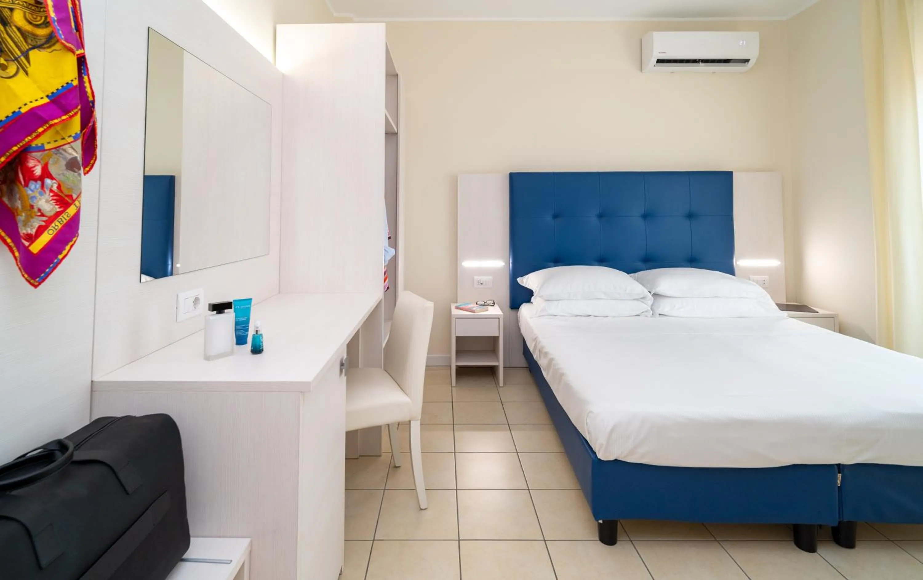 Bed in Hotel Riviera