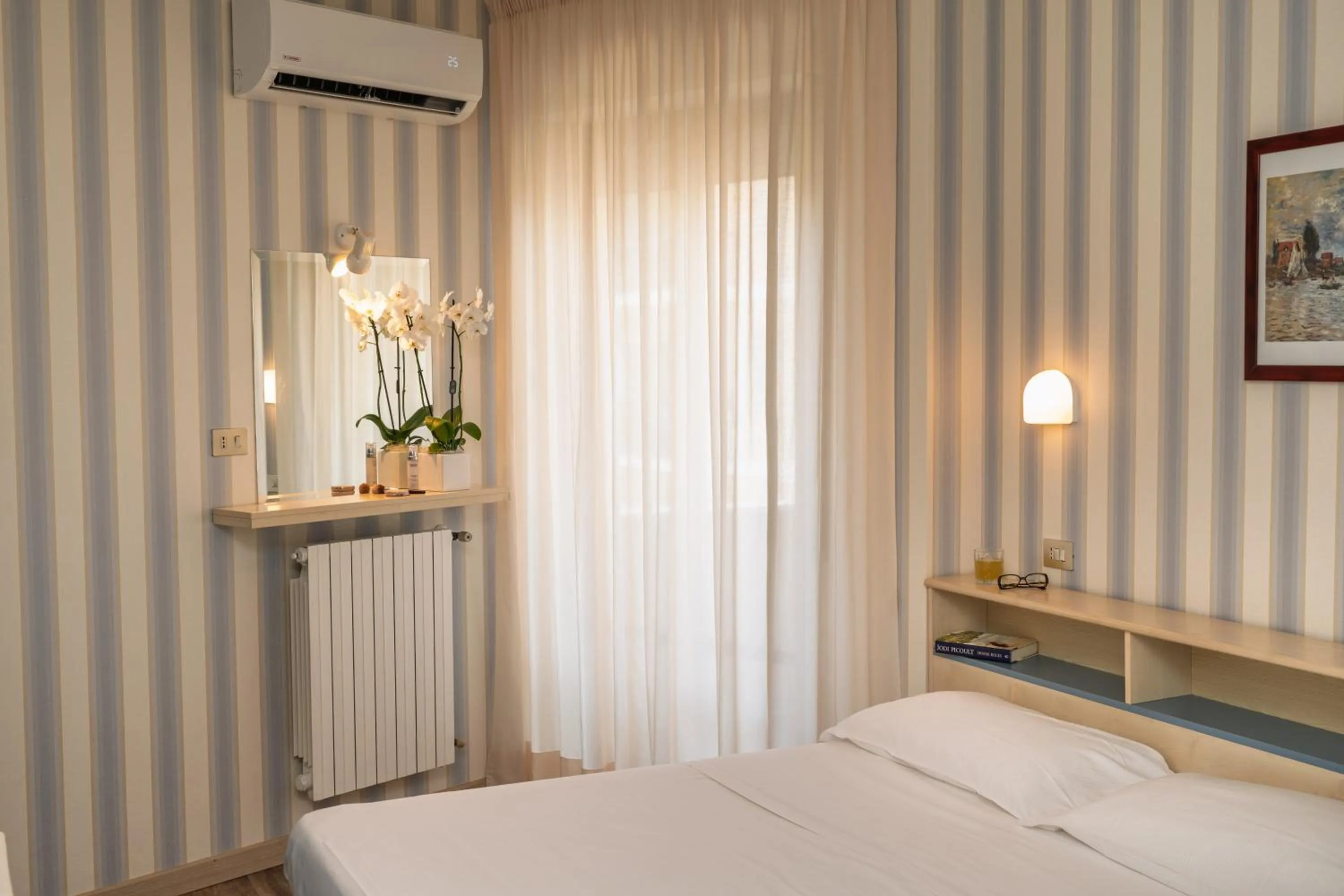 Bed in Hotel Riviera