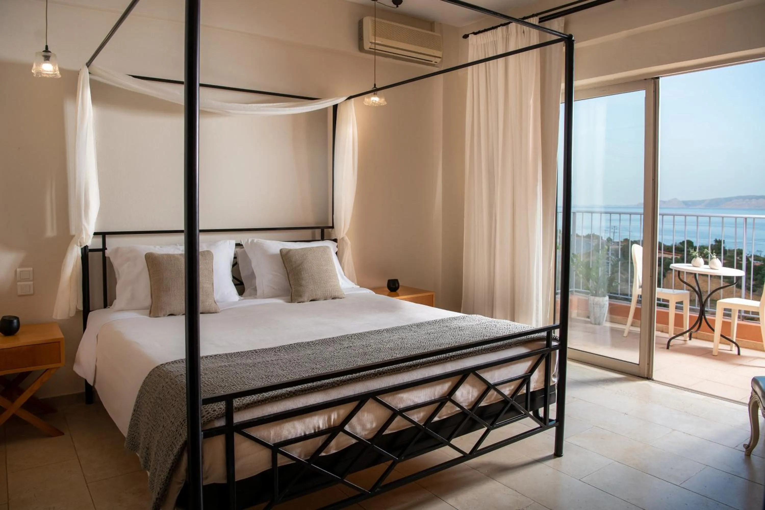 Bed in Pleiades Luxurious Villas