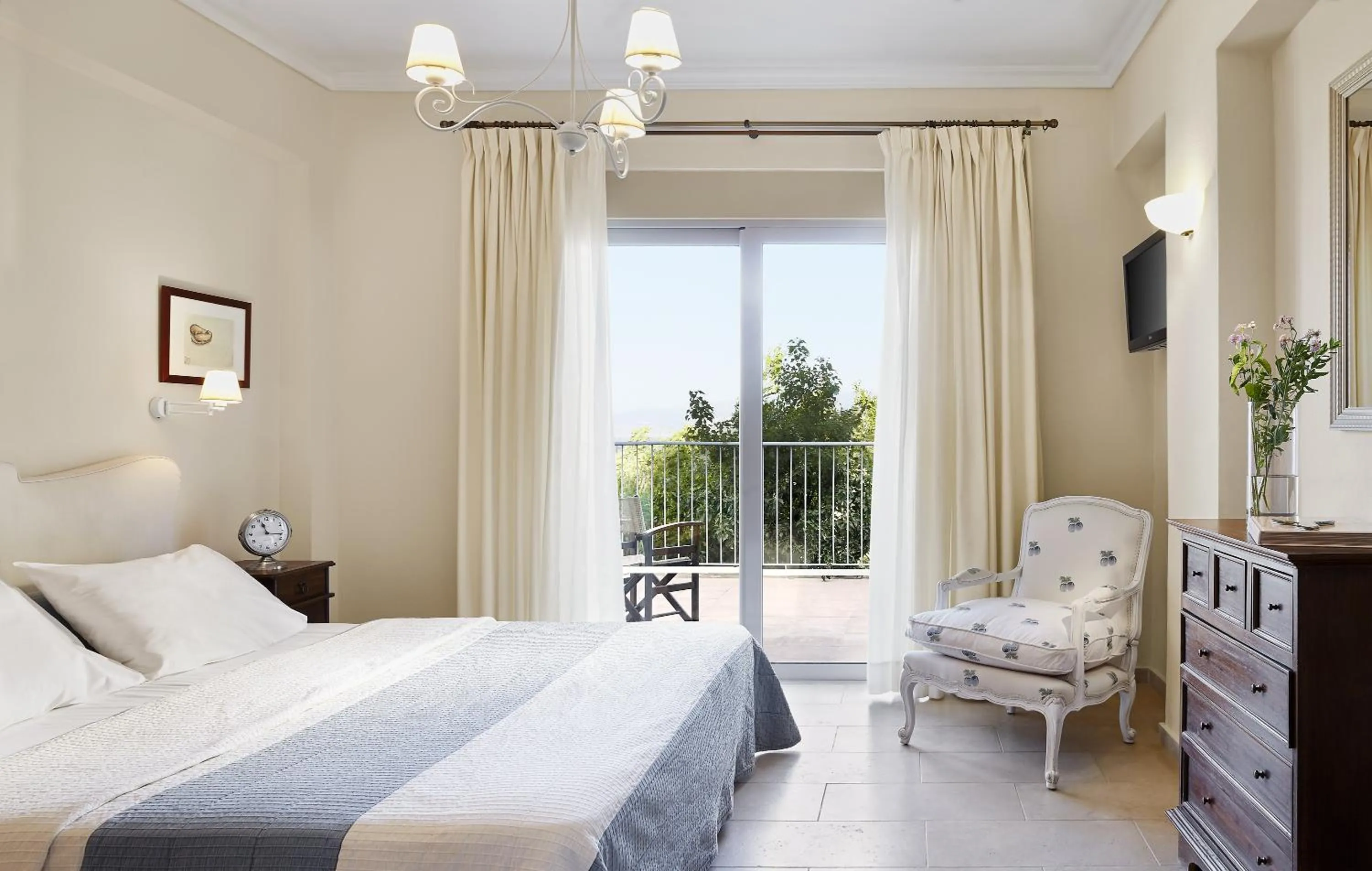 Bed in Pleiades Luxurious Villas