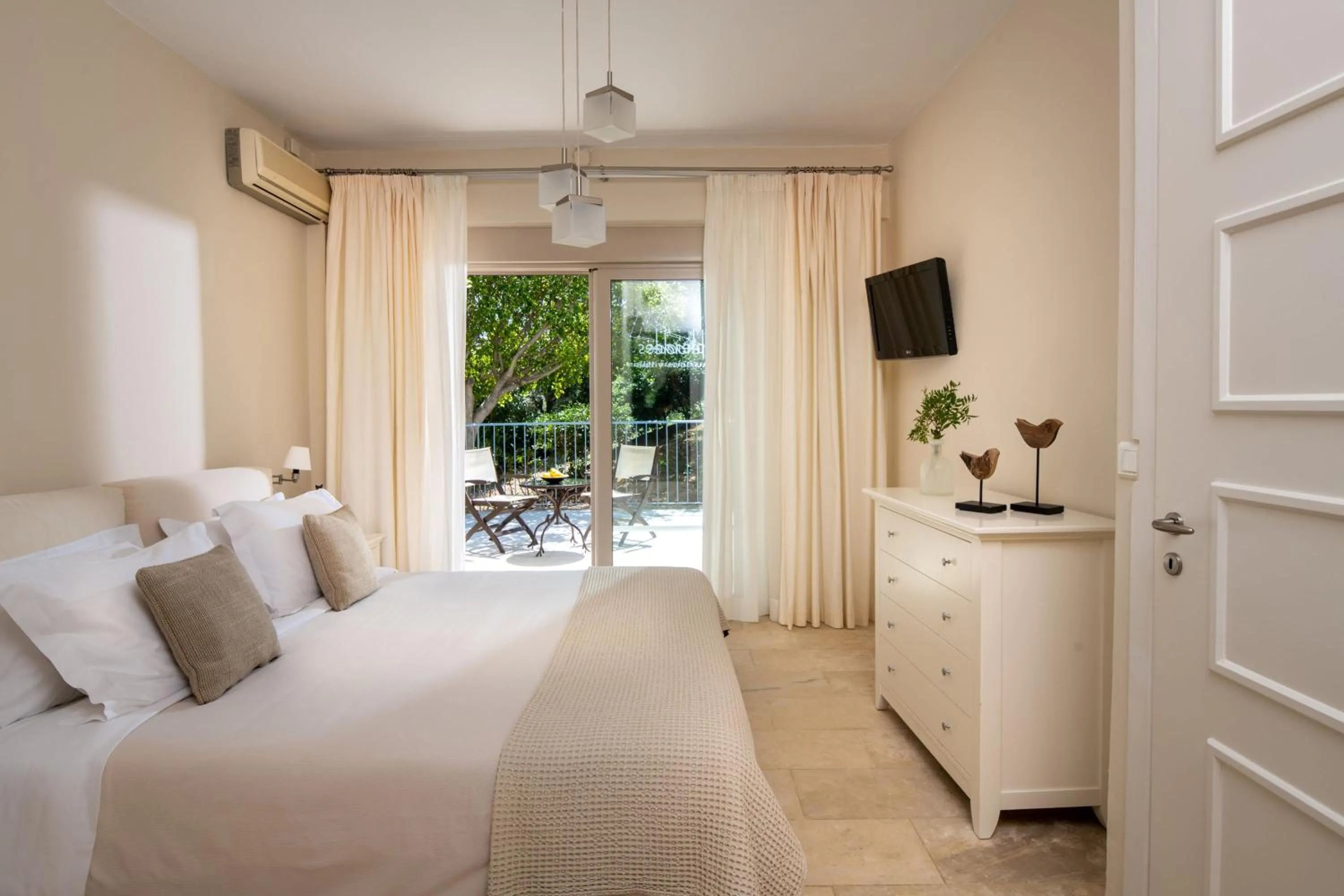Bed in Pleiades Luxurious Villas