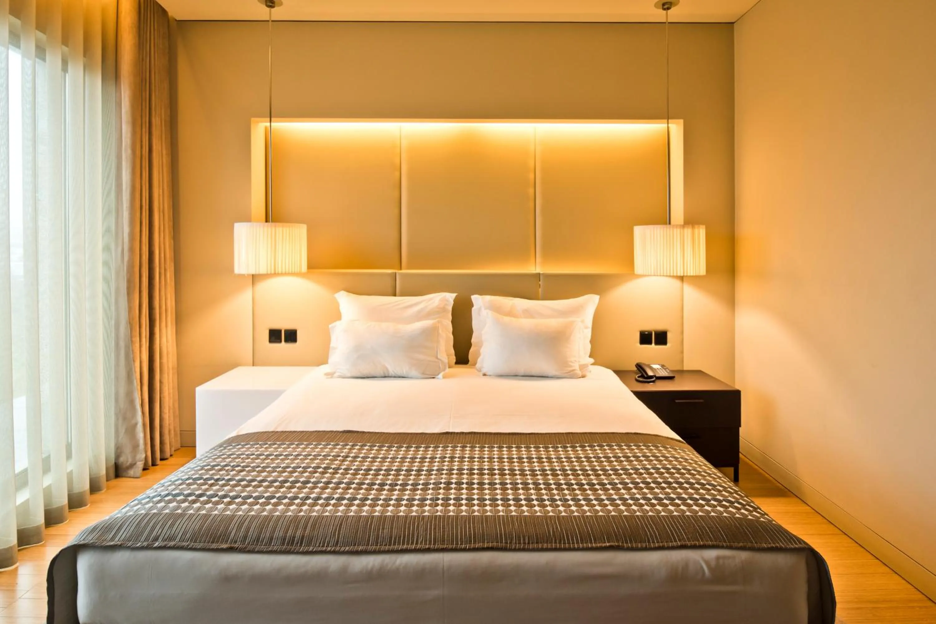 Bed in Golden Tulip São João da Madeira Hotel