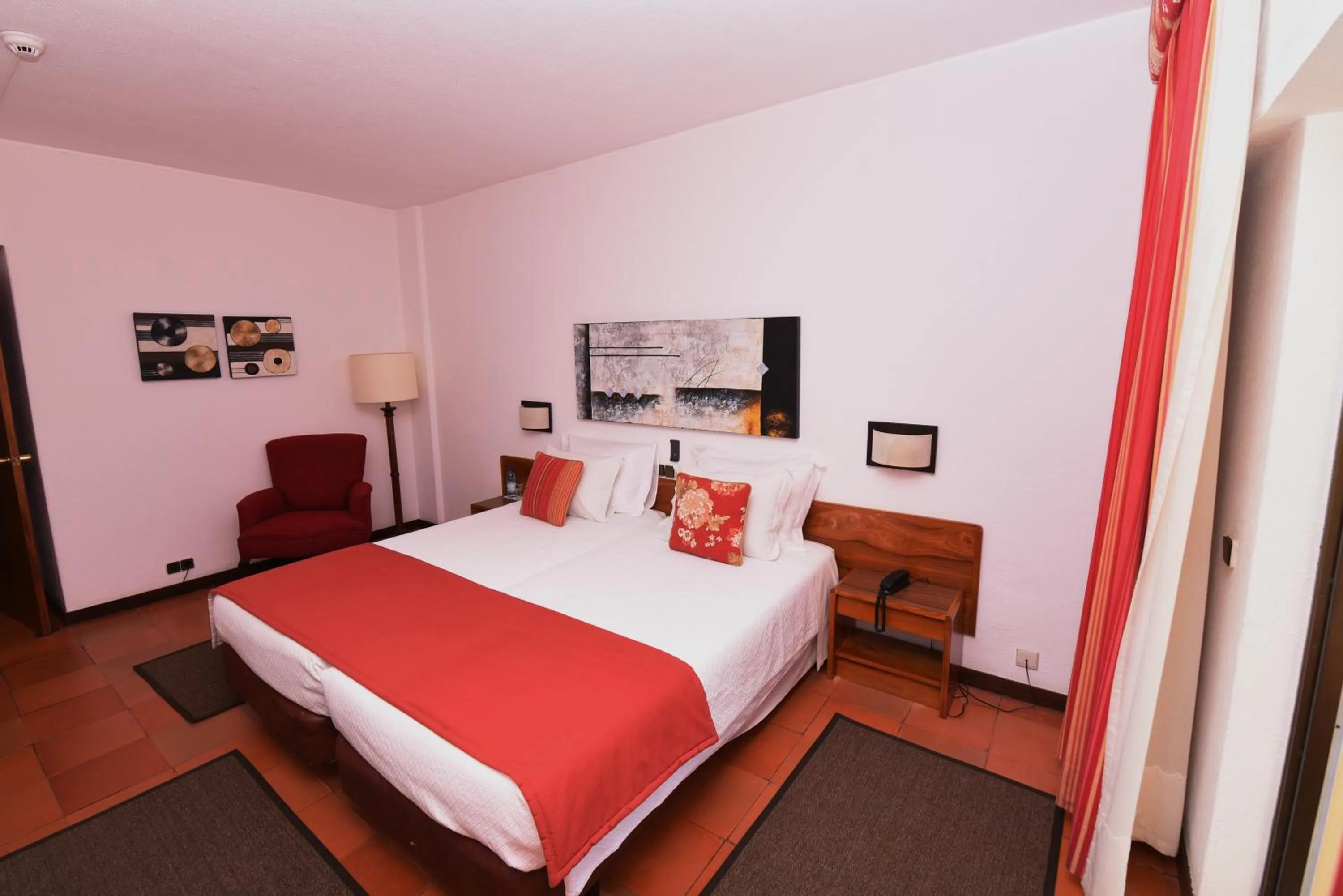 Bed in Praia da Lota Beachfront Resort - Hotel & Apartments