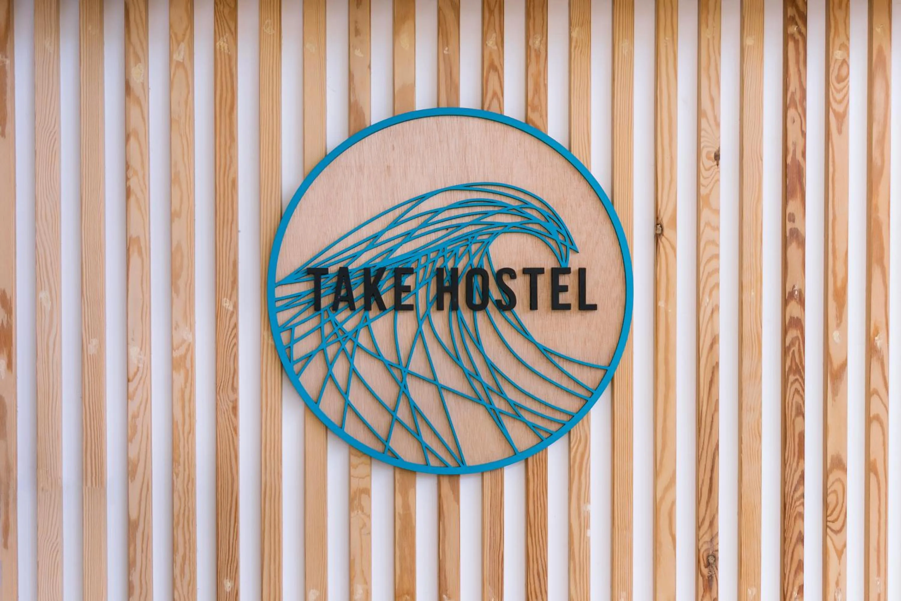 Property logo or sign in TAKE SURF Hostel Conil