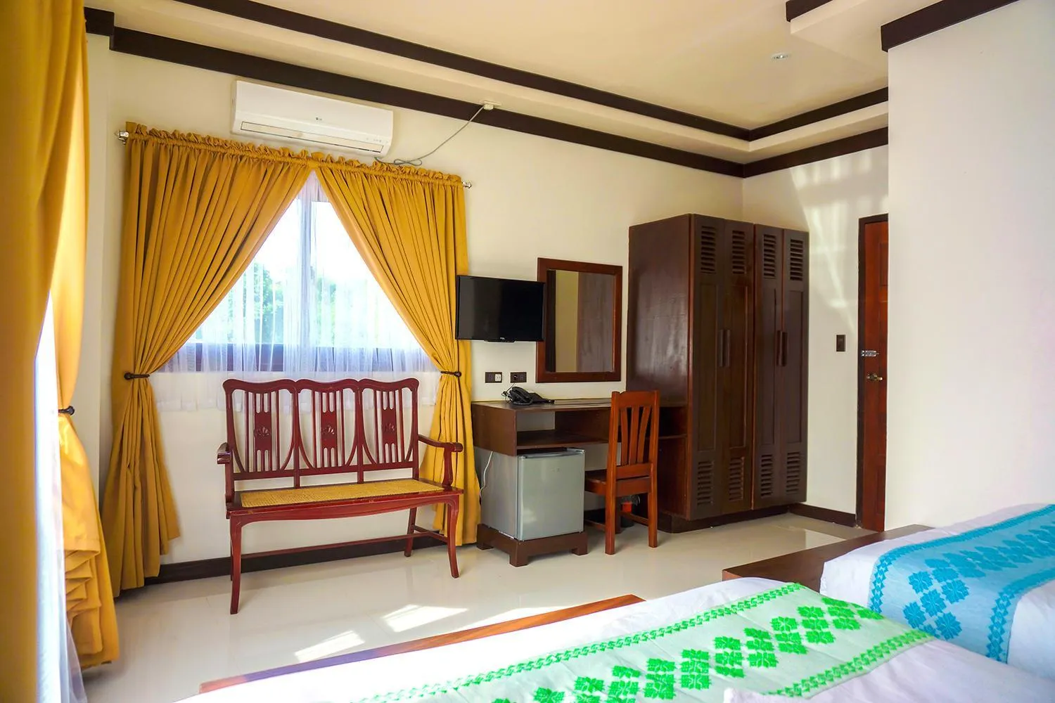 Bed in Veranda Suites and Restaurant