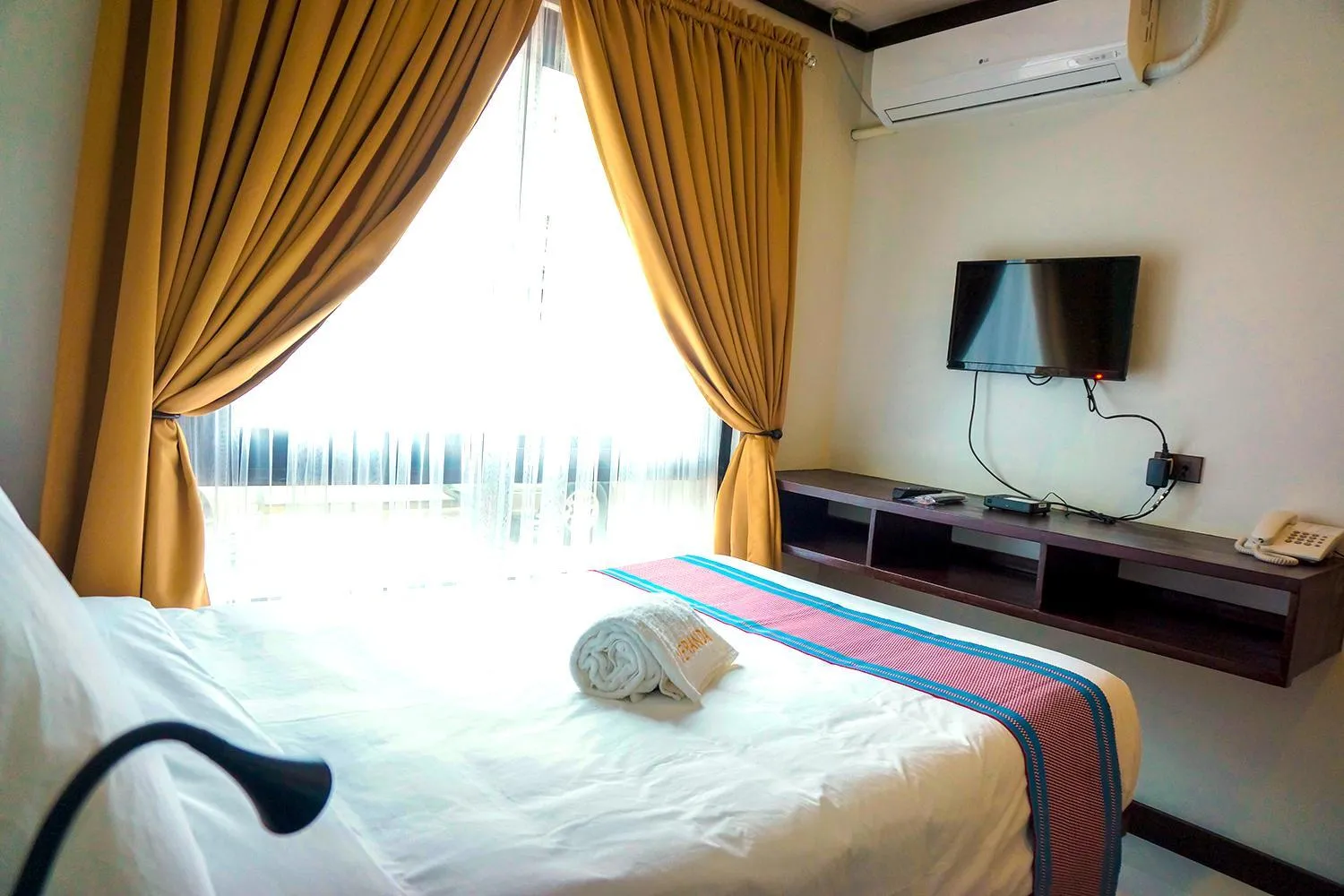 Bed in Veranda Suites and Restaurant