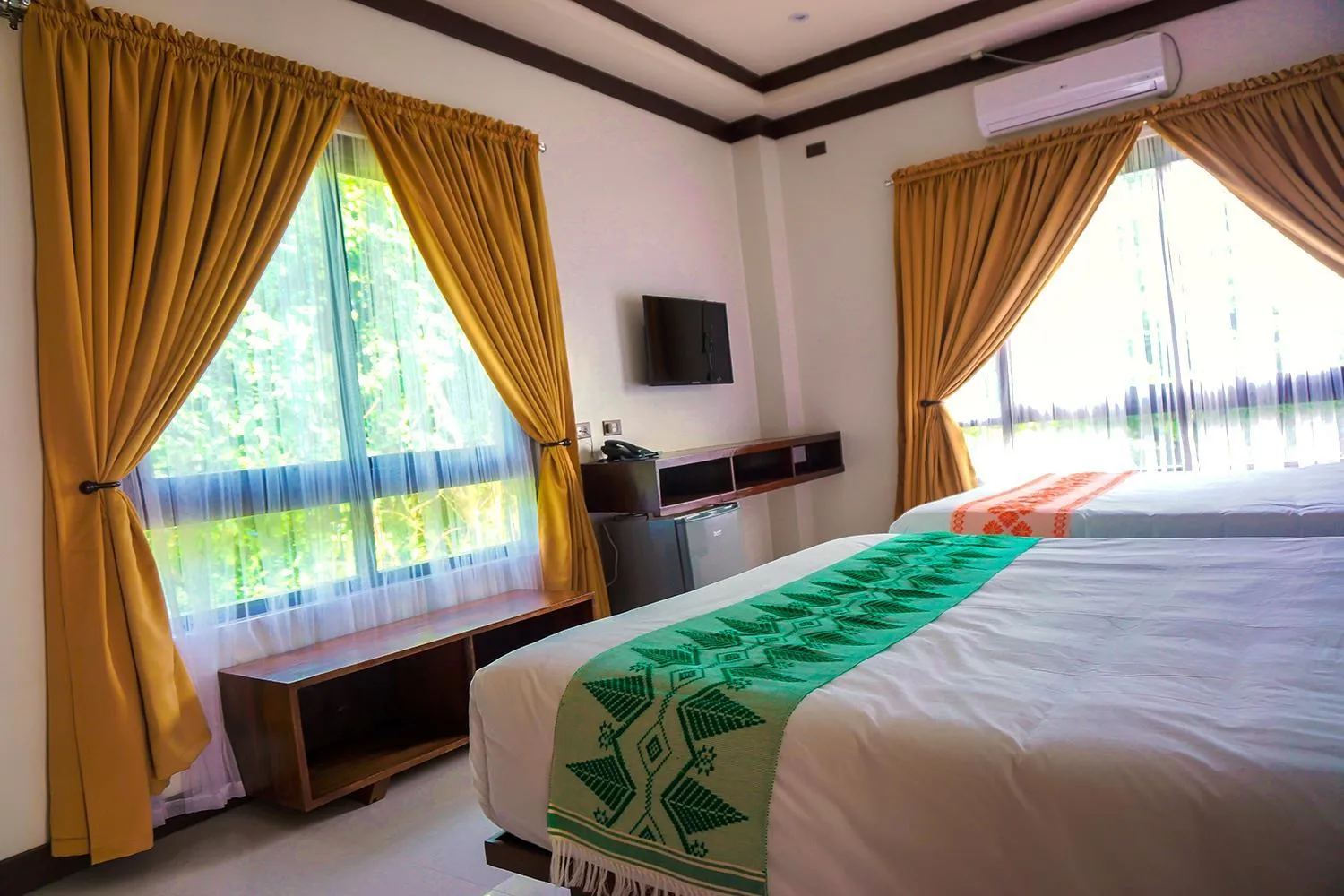 Bed in Veranda Suites and Restaurant