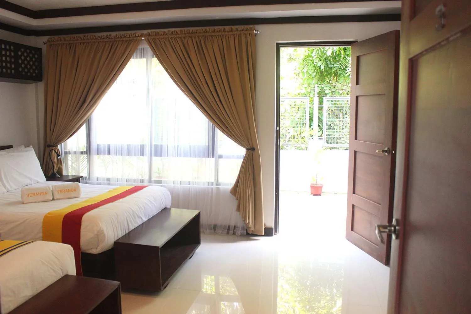 Bed in Veranda Suites and Restaurant