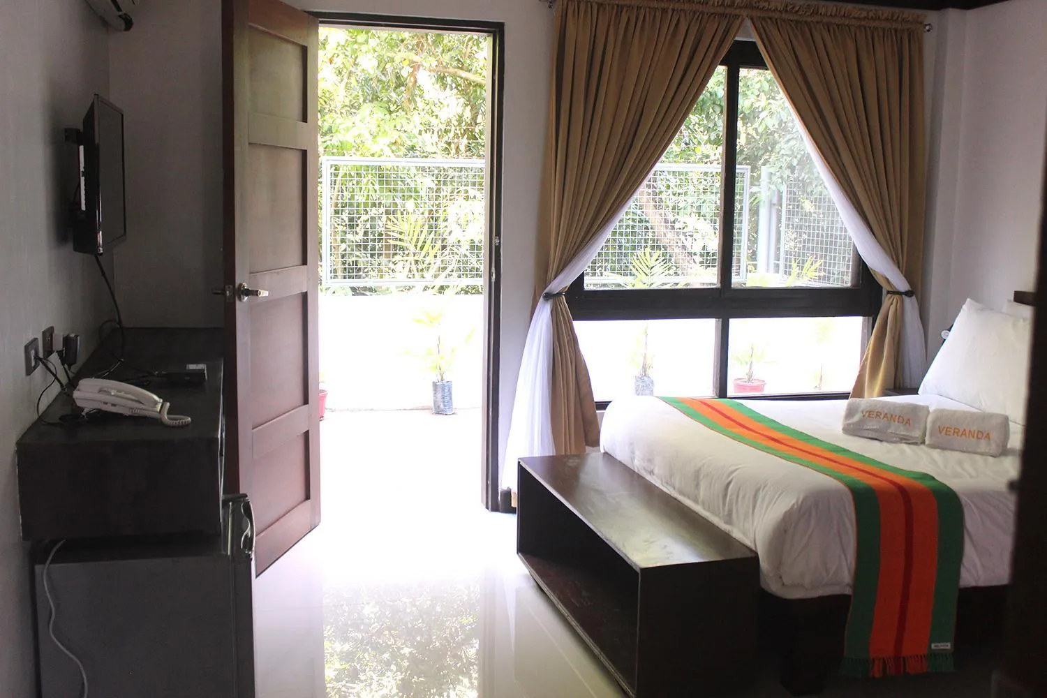 Bed in Veranda Suites and Restaurant