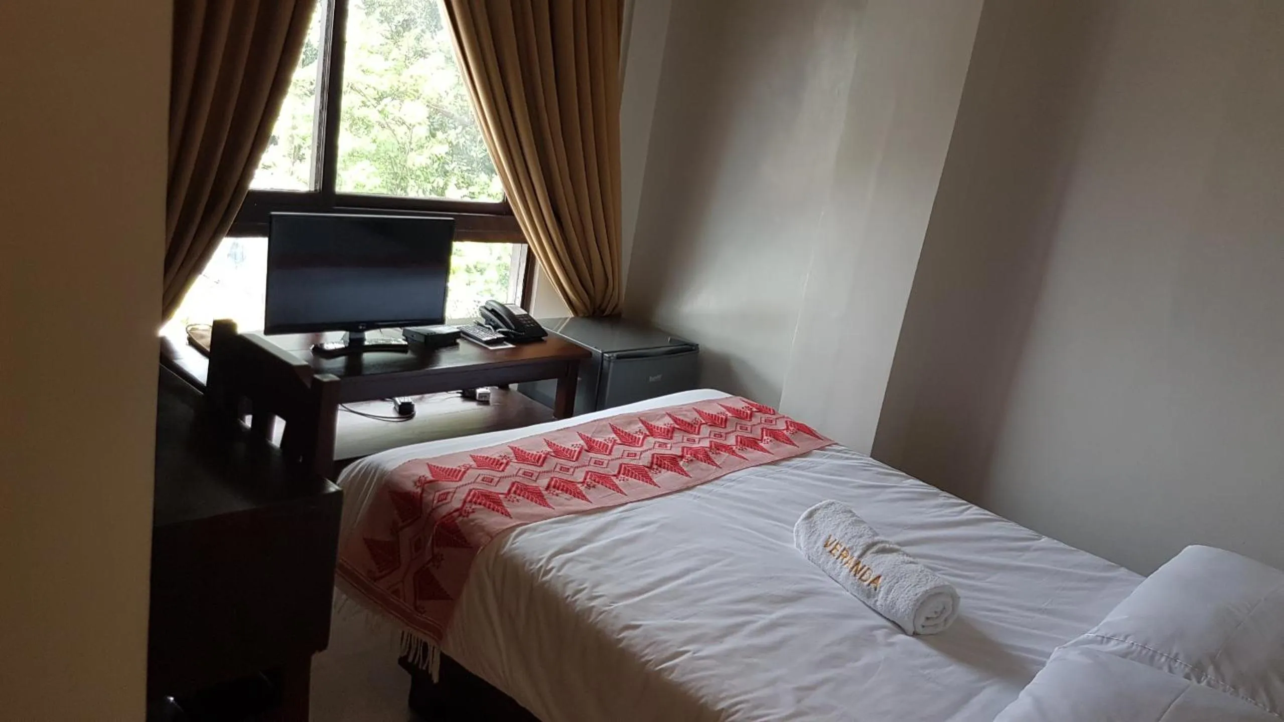 Bed in Veranda Suites and Restaurant