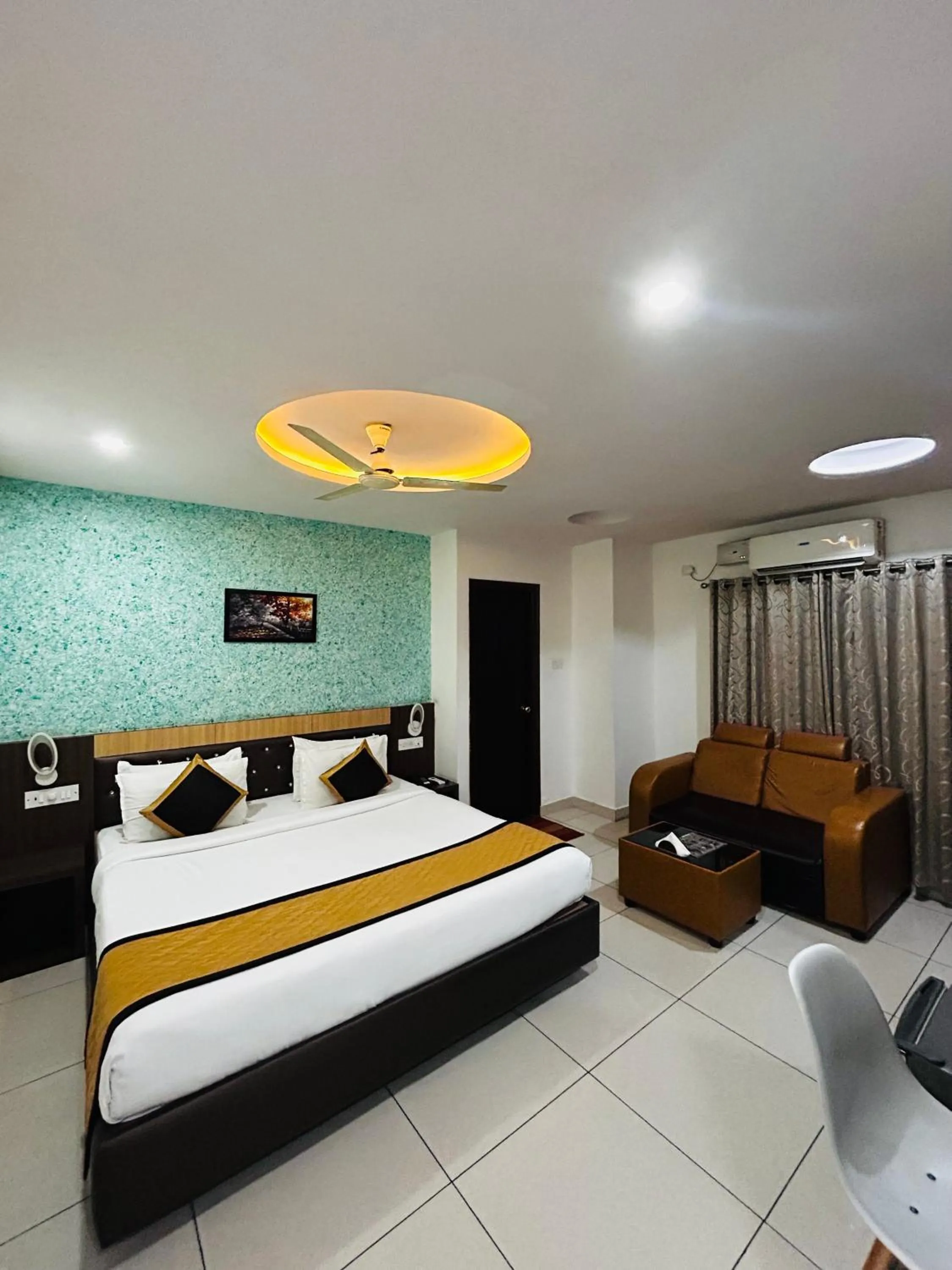 Photo of the whole room, Bed in The Porch Inn Hotel & Service Apartments Near Nimhans Hospital