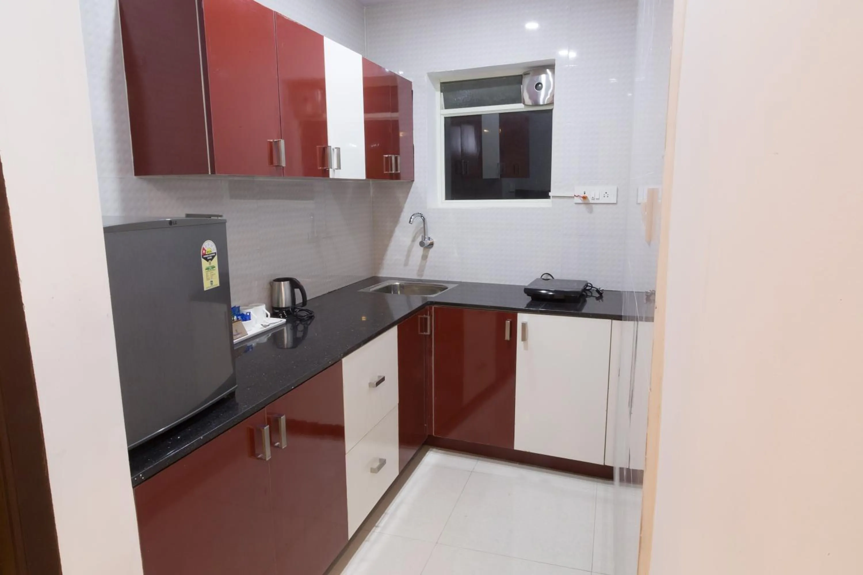 Kitchen or kitchenette in The Porch Inn Hotel & Service Apartments Near Nimhans Hospital