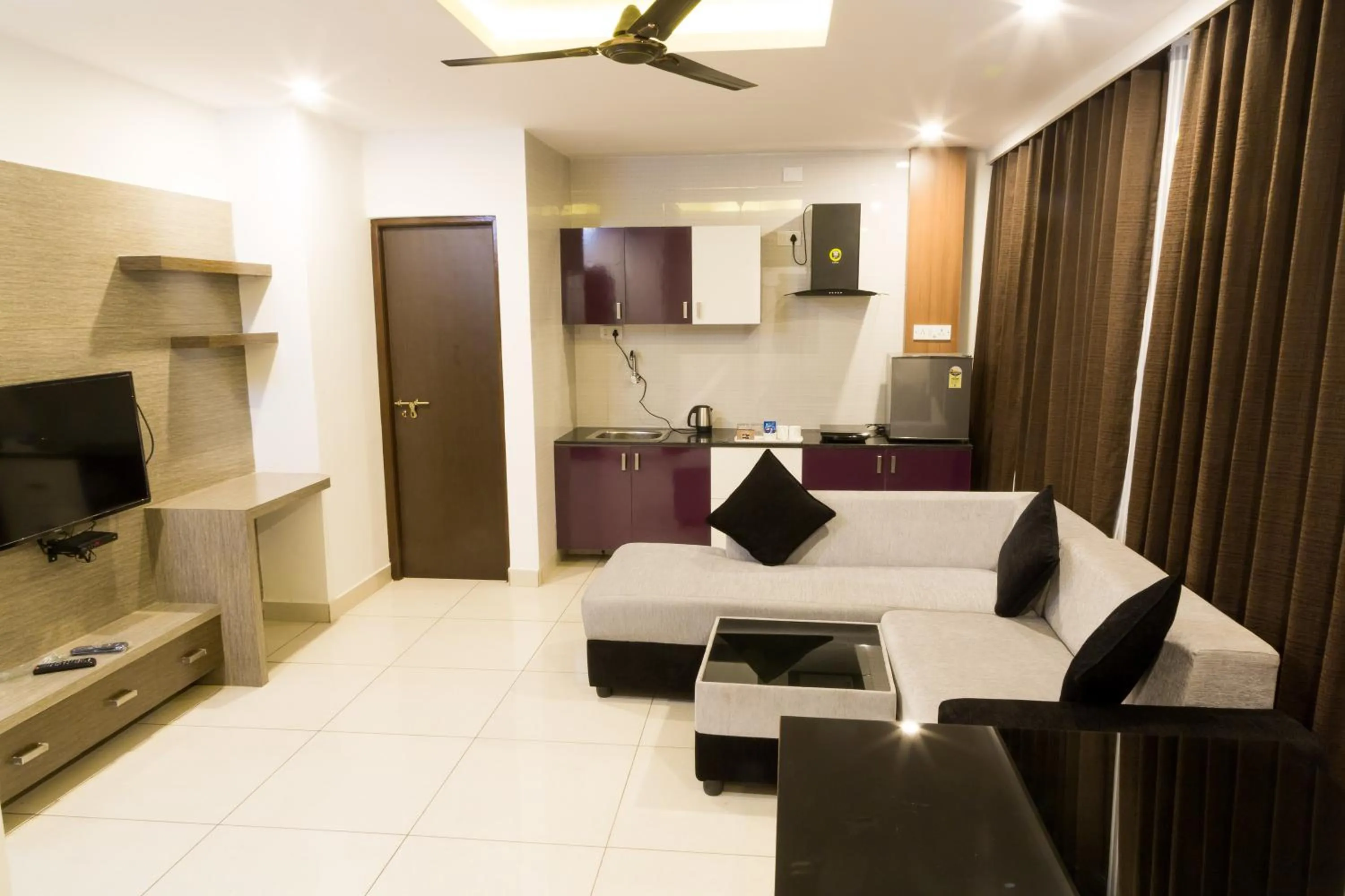 Living room, Bed in The Porch Inn Hotel & Service Apartments Near Nimhans Hospital