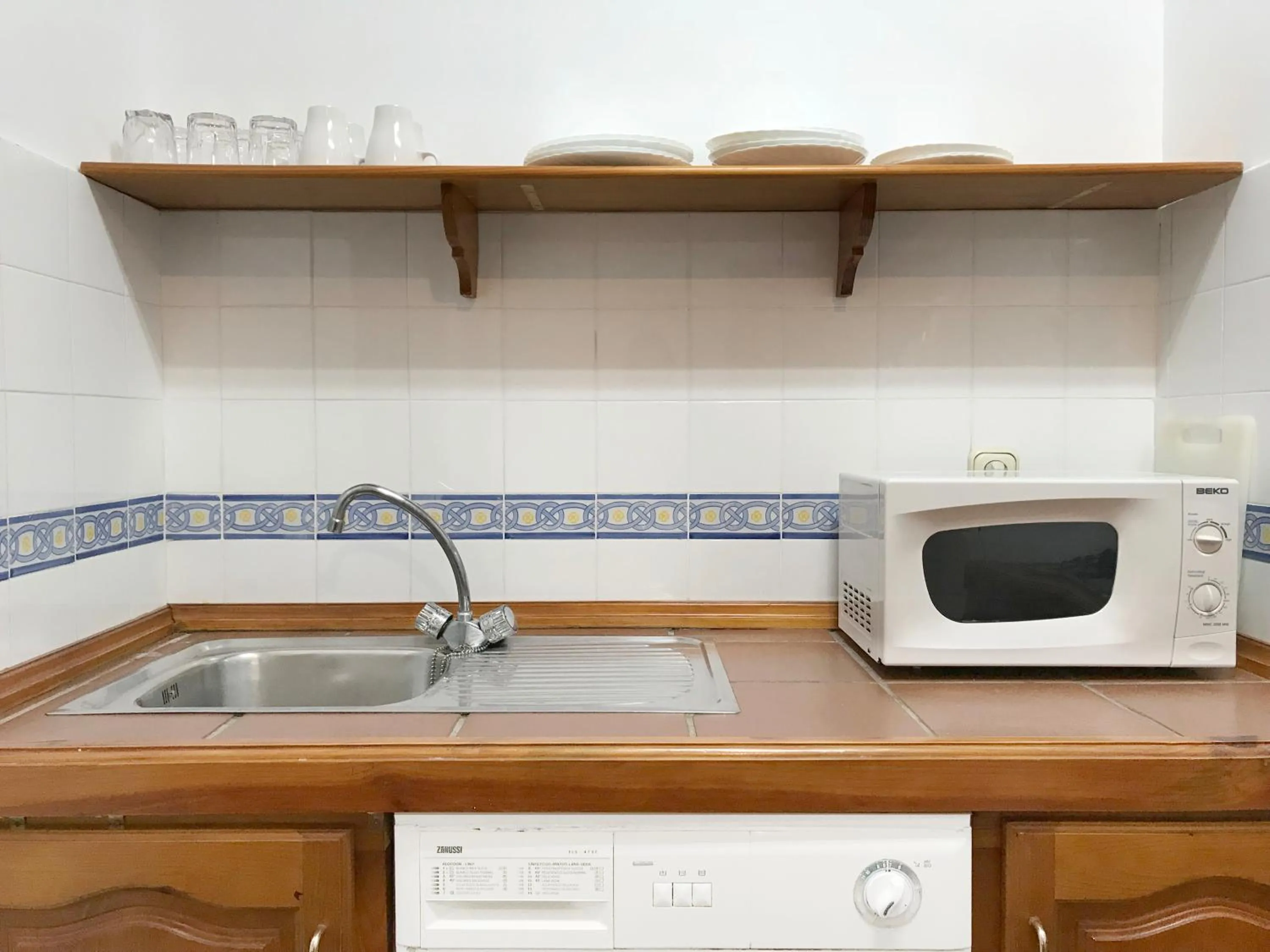 Kitchen or kitchenette in Apartamentos Turísticos La Mundial