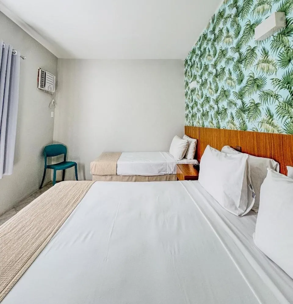 Bed in Ilha Porchat Hotel