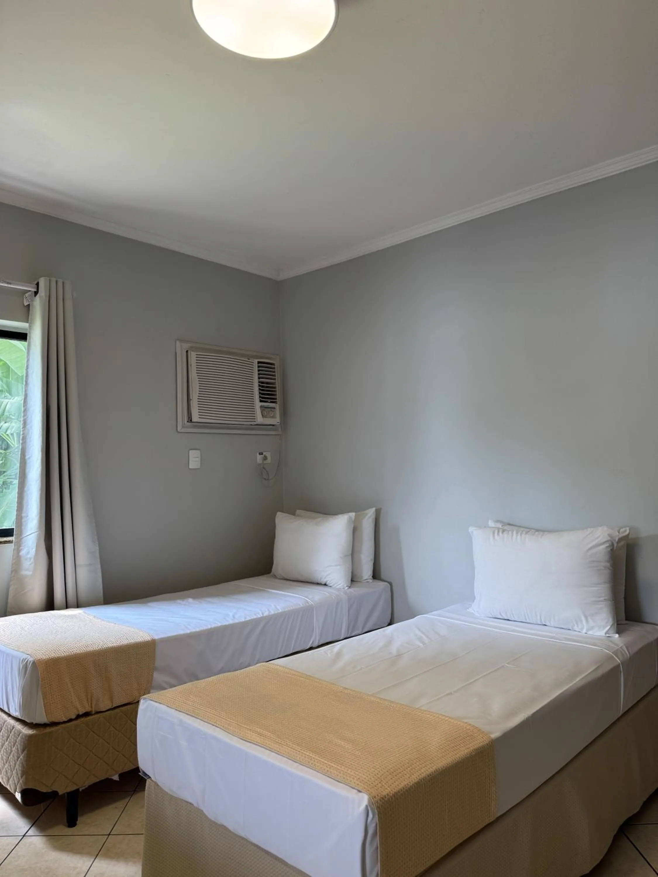 Bed in Ilha Porchat Hotel