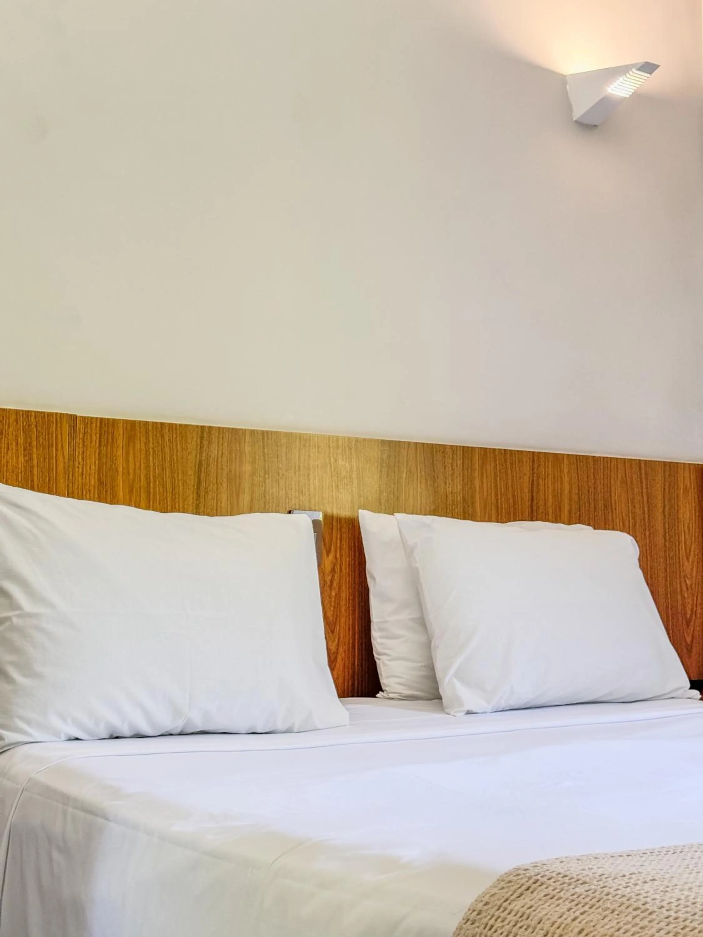 Bed in Ilha Porchat Hotel