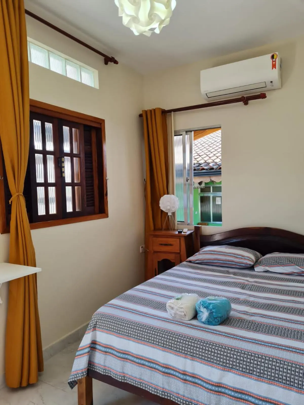 Bed in Pousada Reis Guarujá