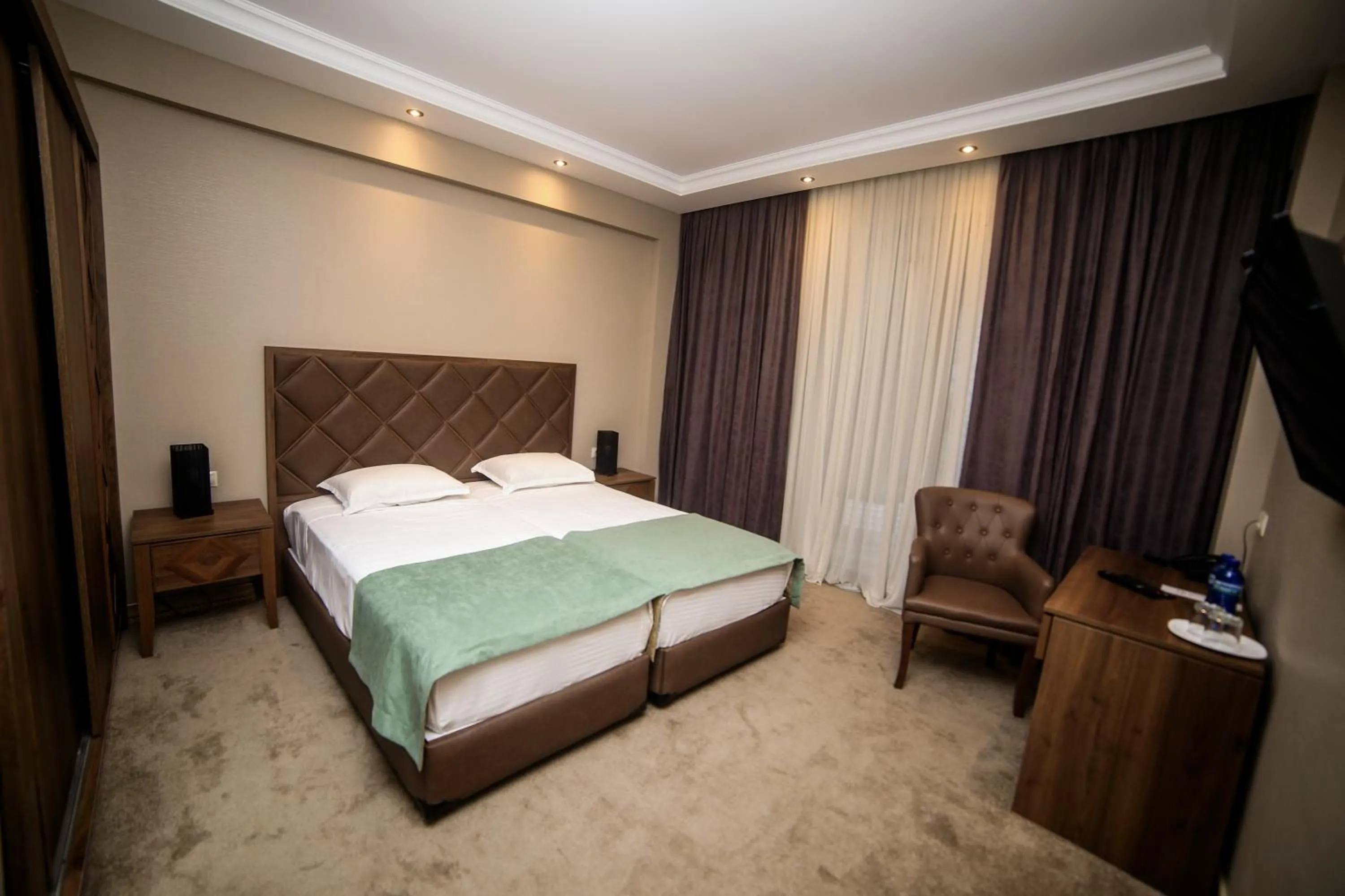 Bed in Boutique Hotel Mimino