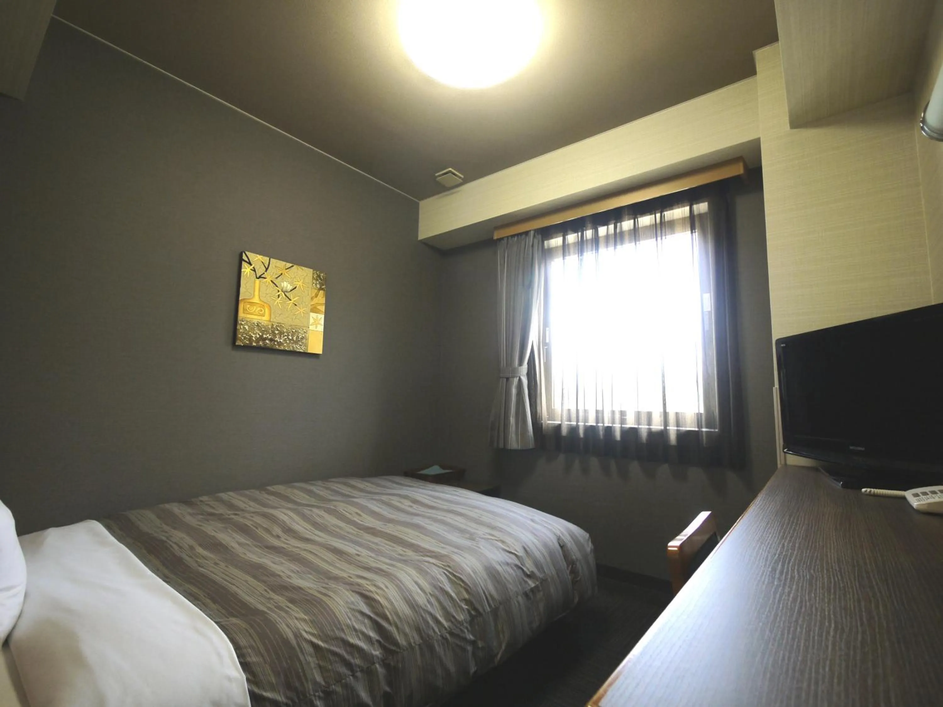 Bed in Hotel Route-Inn Nakatsugawa Inter