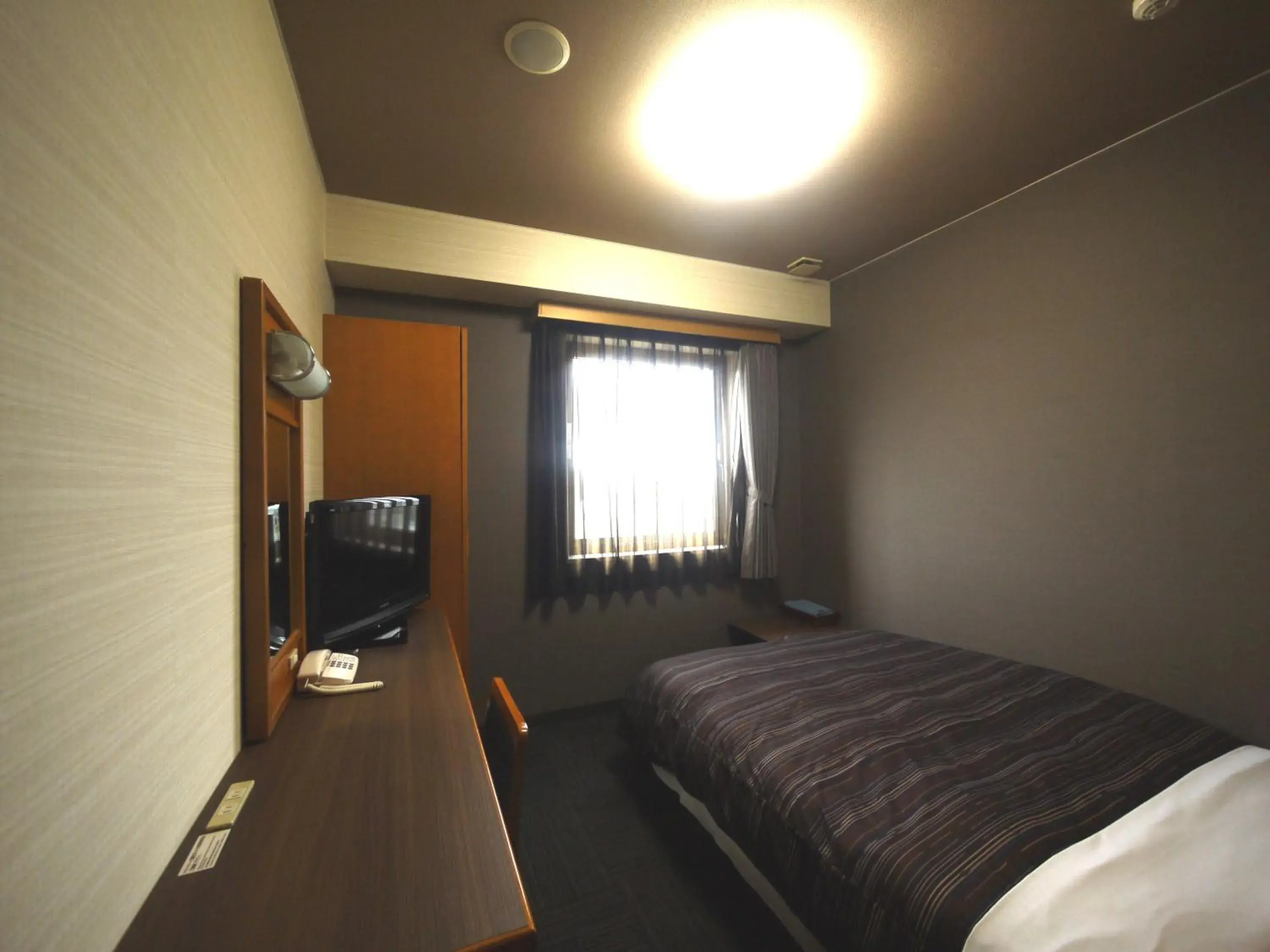 Bed in Hotel Route-Inn Nakatsugawa Inter Bed in Hotel Route-Inn Nakatsugawa Inter
