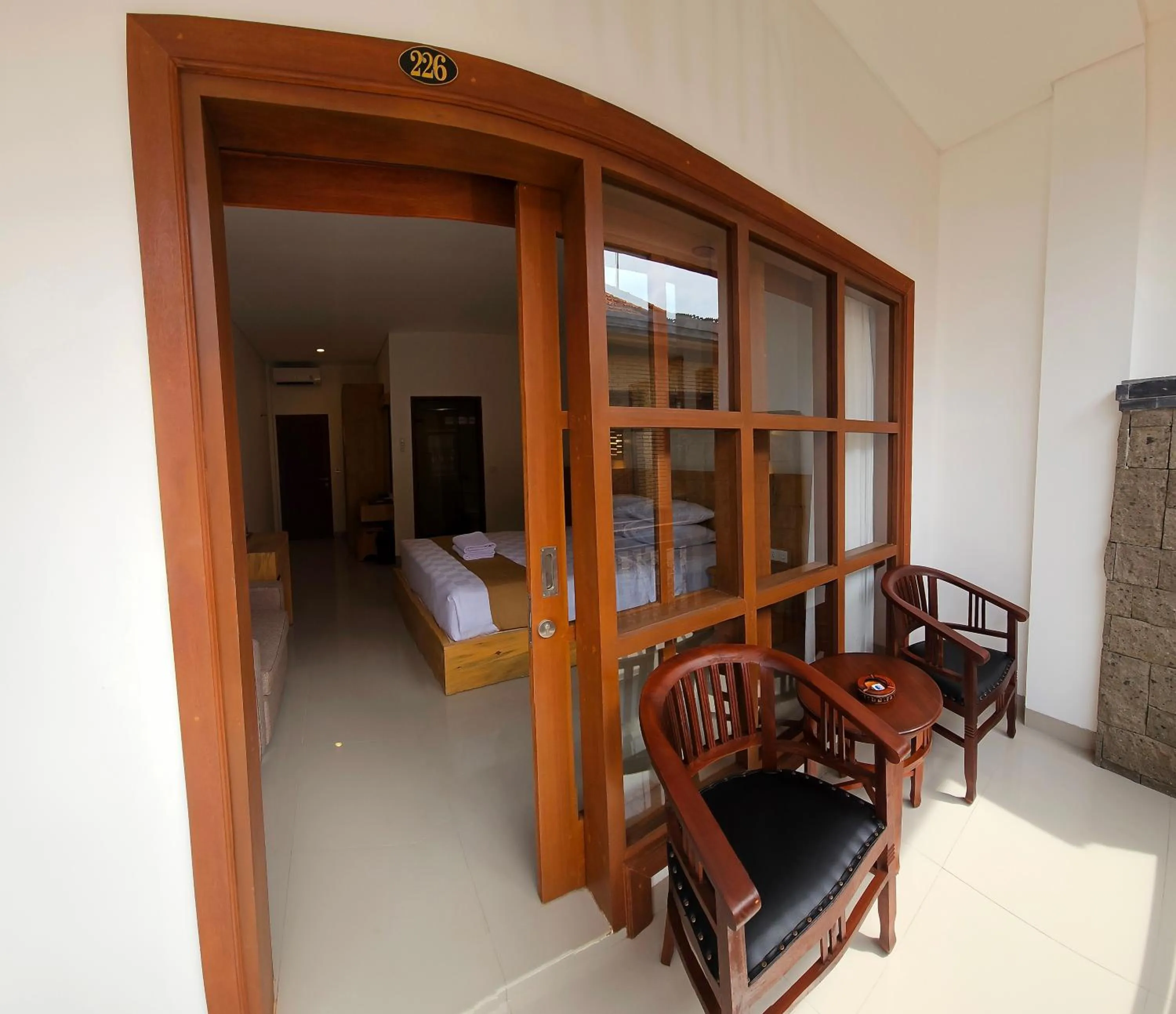 Seating area, Bed in Satriya Cottages
