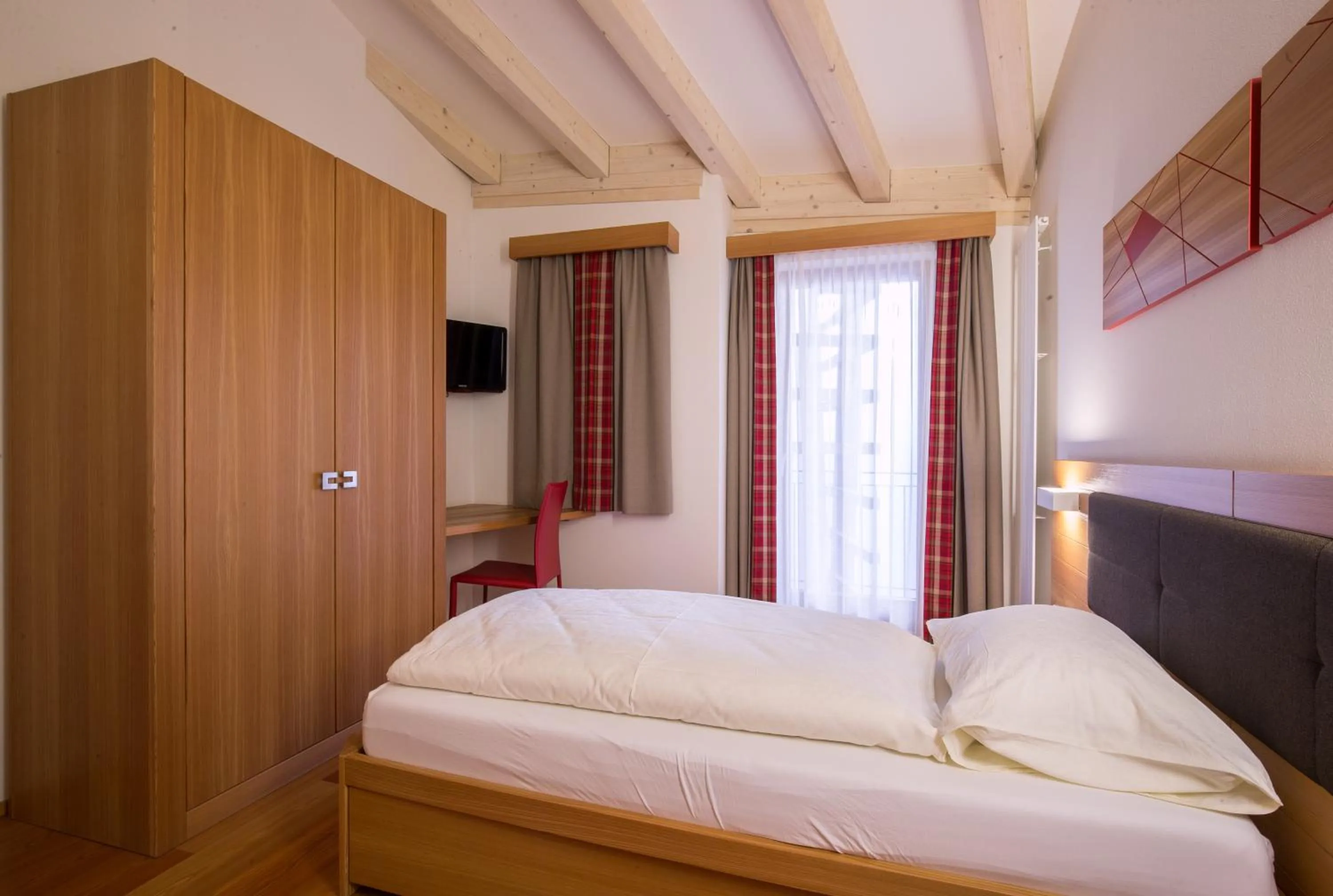 Bed in Hotel Al Cervo