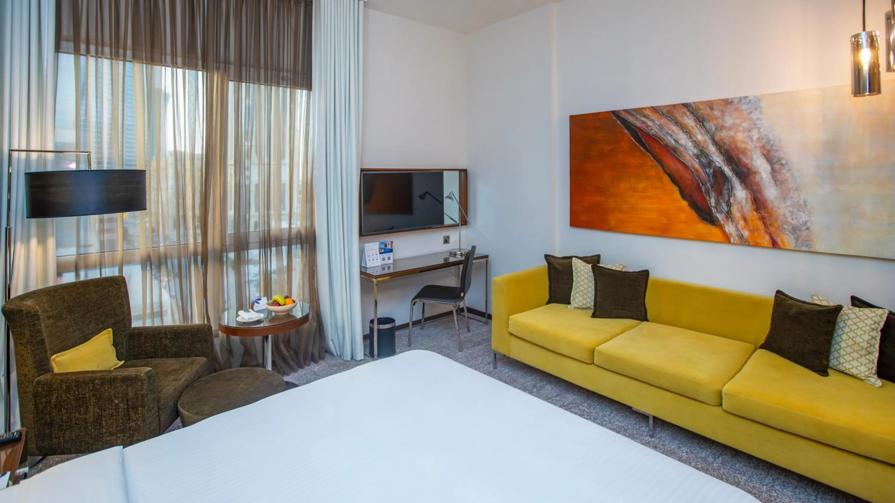 Seating area, Bed in Centro Olaya by Rotana
