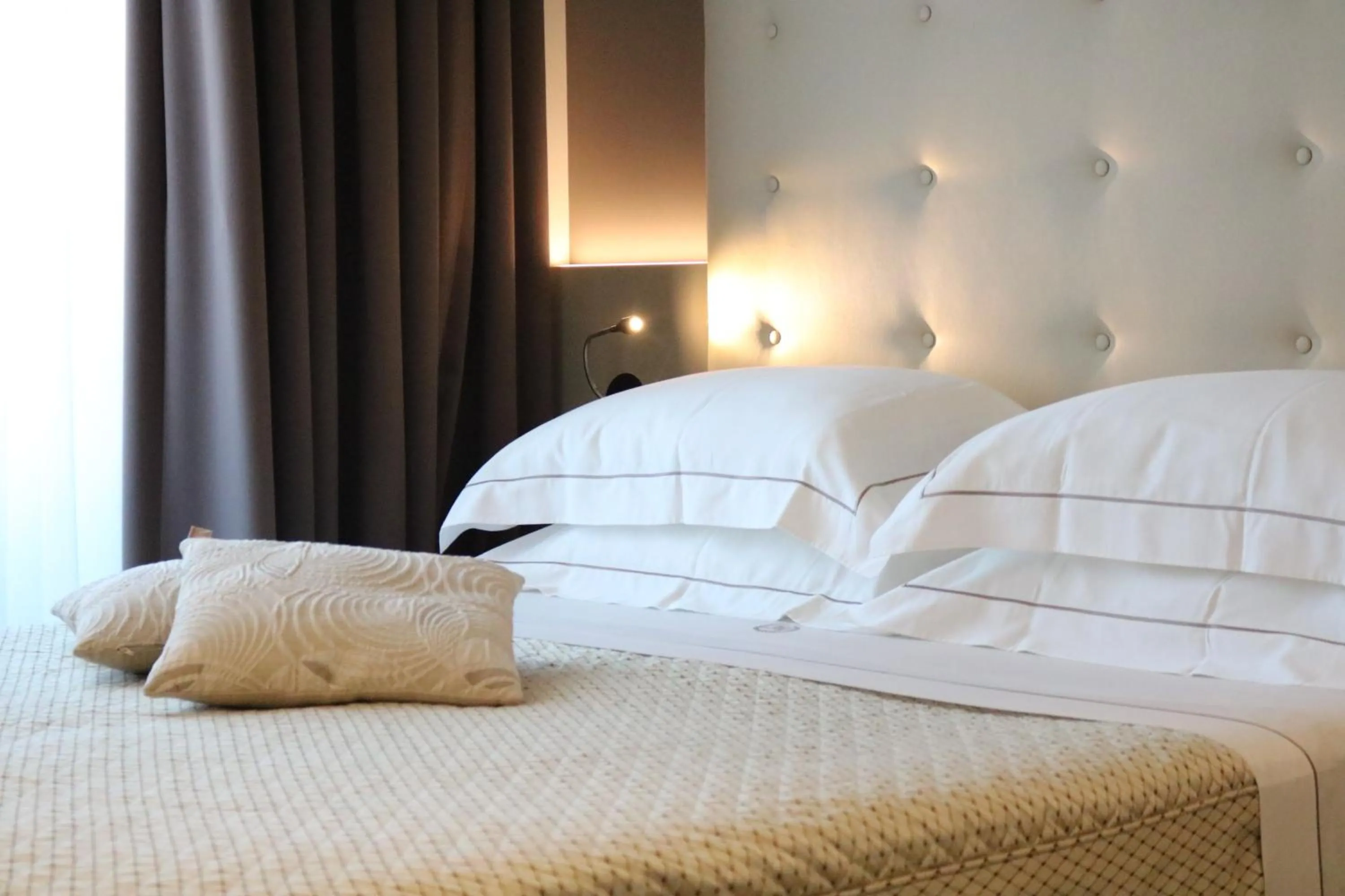 Bed in Majestic Beach Hotel & Wellness