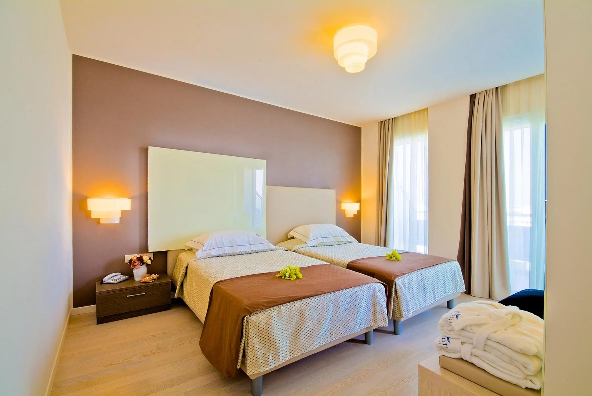 Bed in Majestic Beach Hotel & Wellness