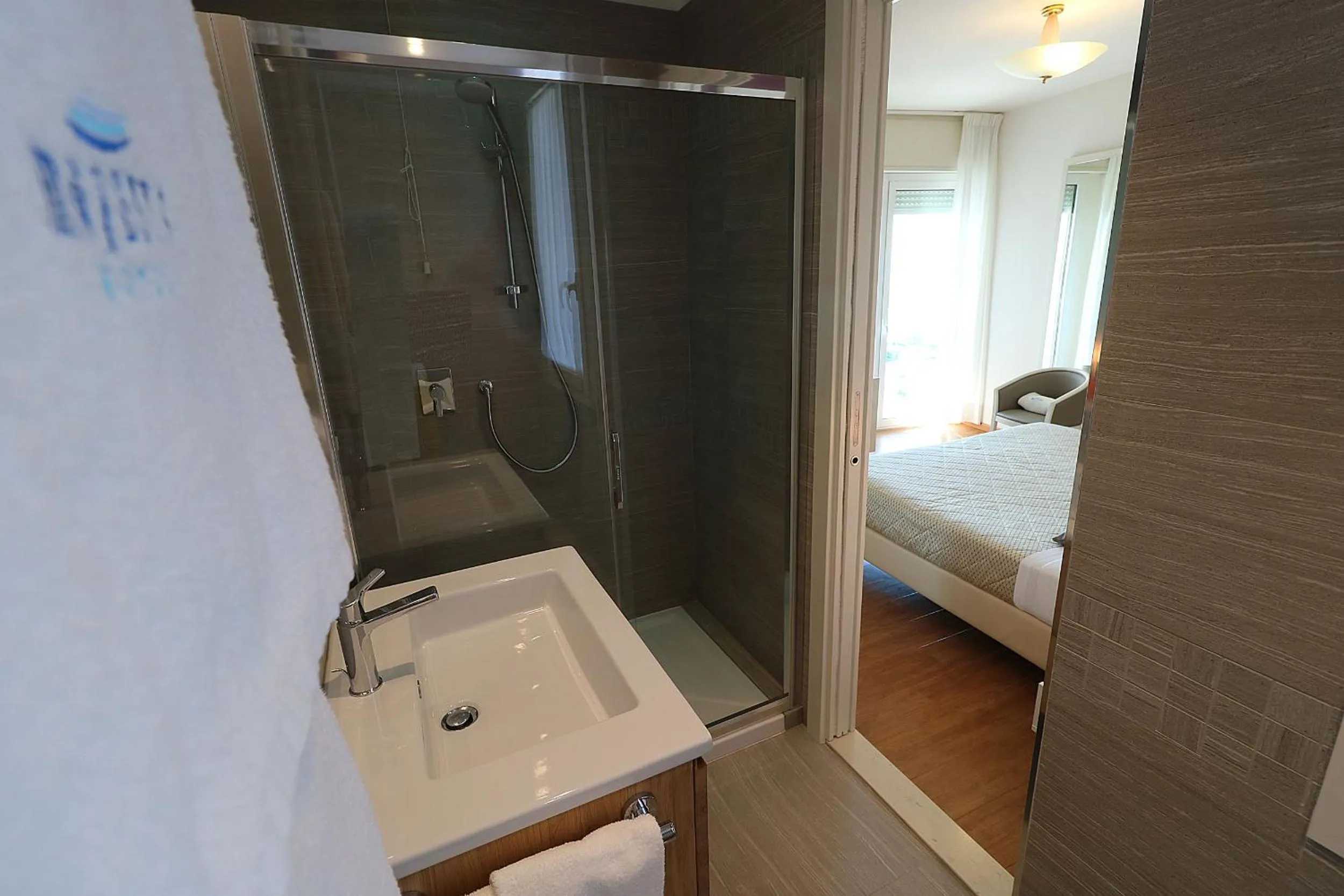 Bed in Majestic Beach Hotel & Wellness