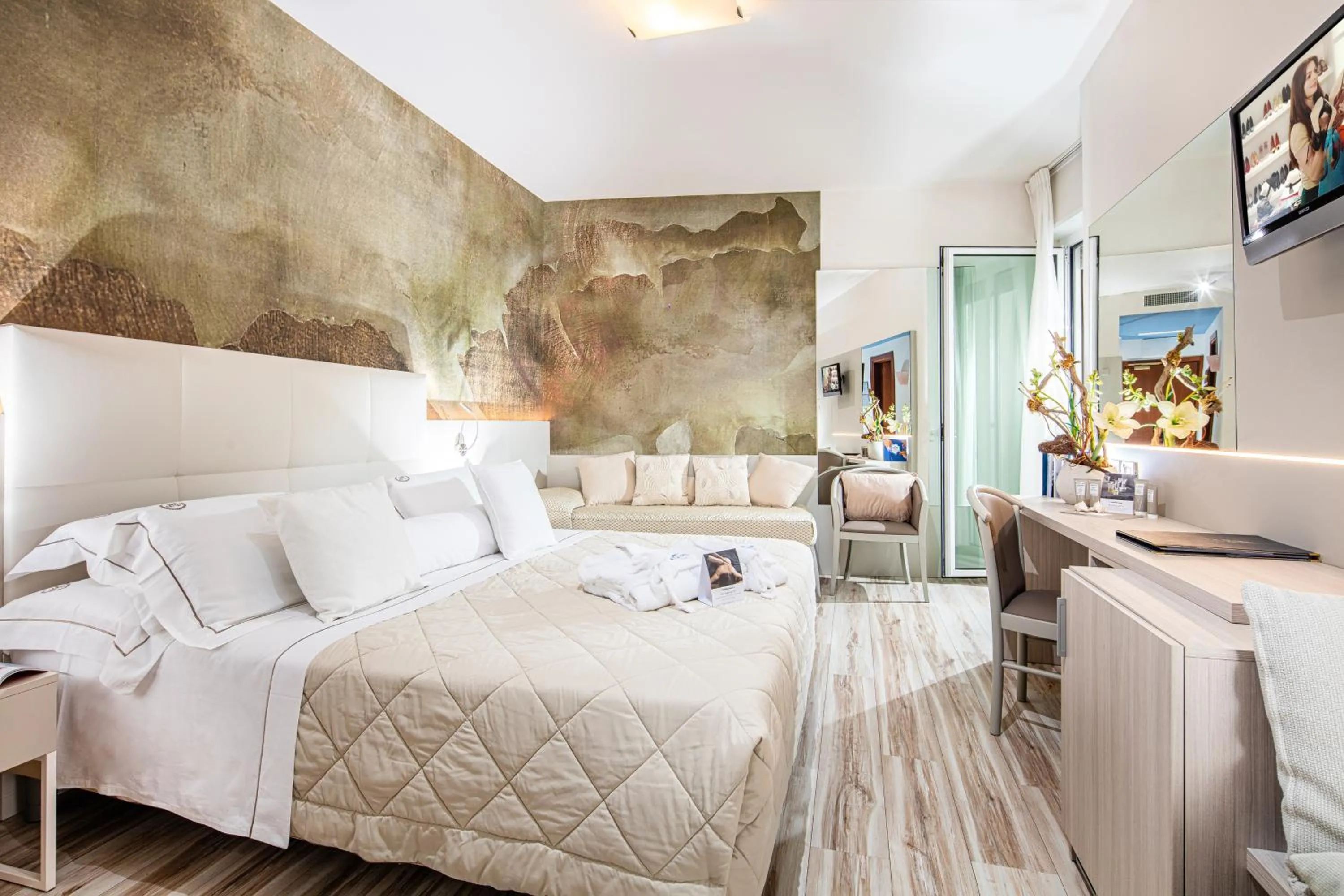 Bed in Majestic Beach Hotel & Wellness