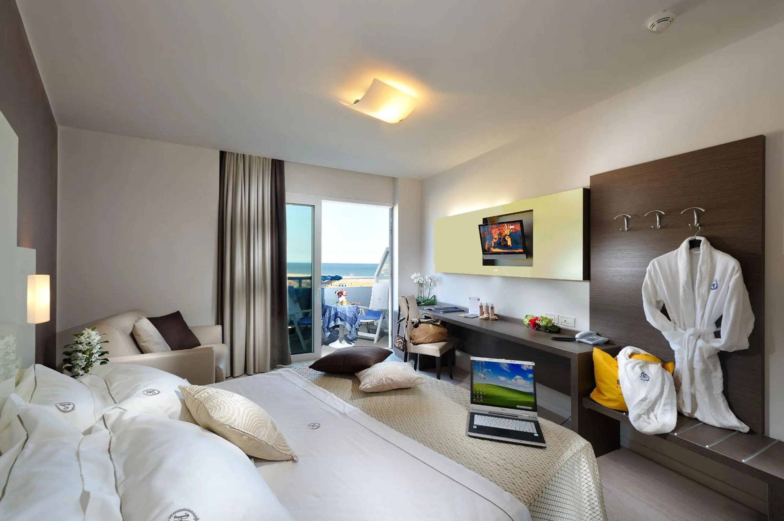 Bed in Majestic Beach Hotel & Wellness