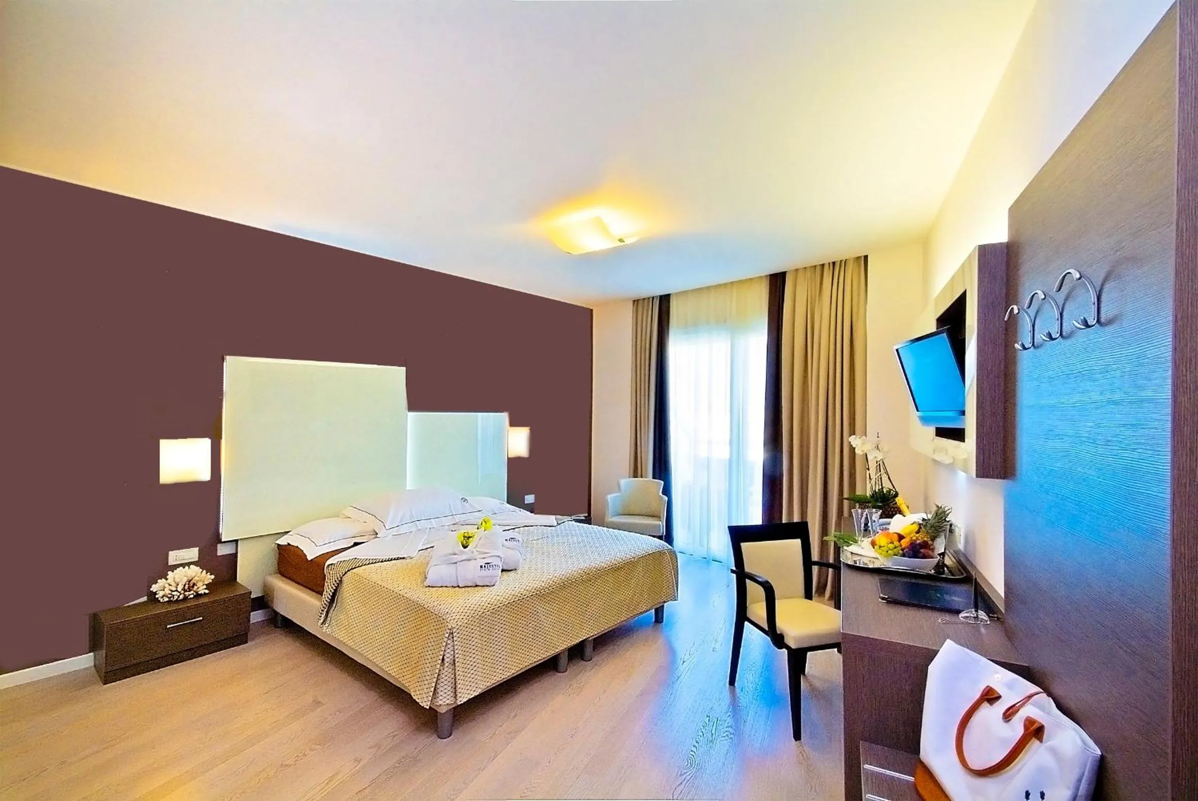 Bed in Majestic Beach Hotel & Wellness