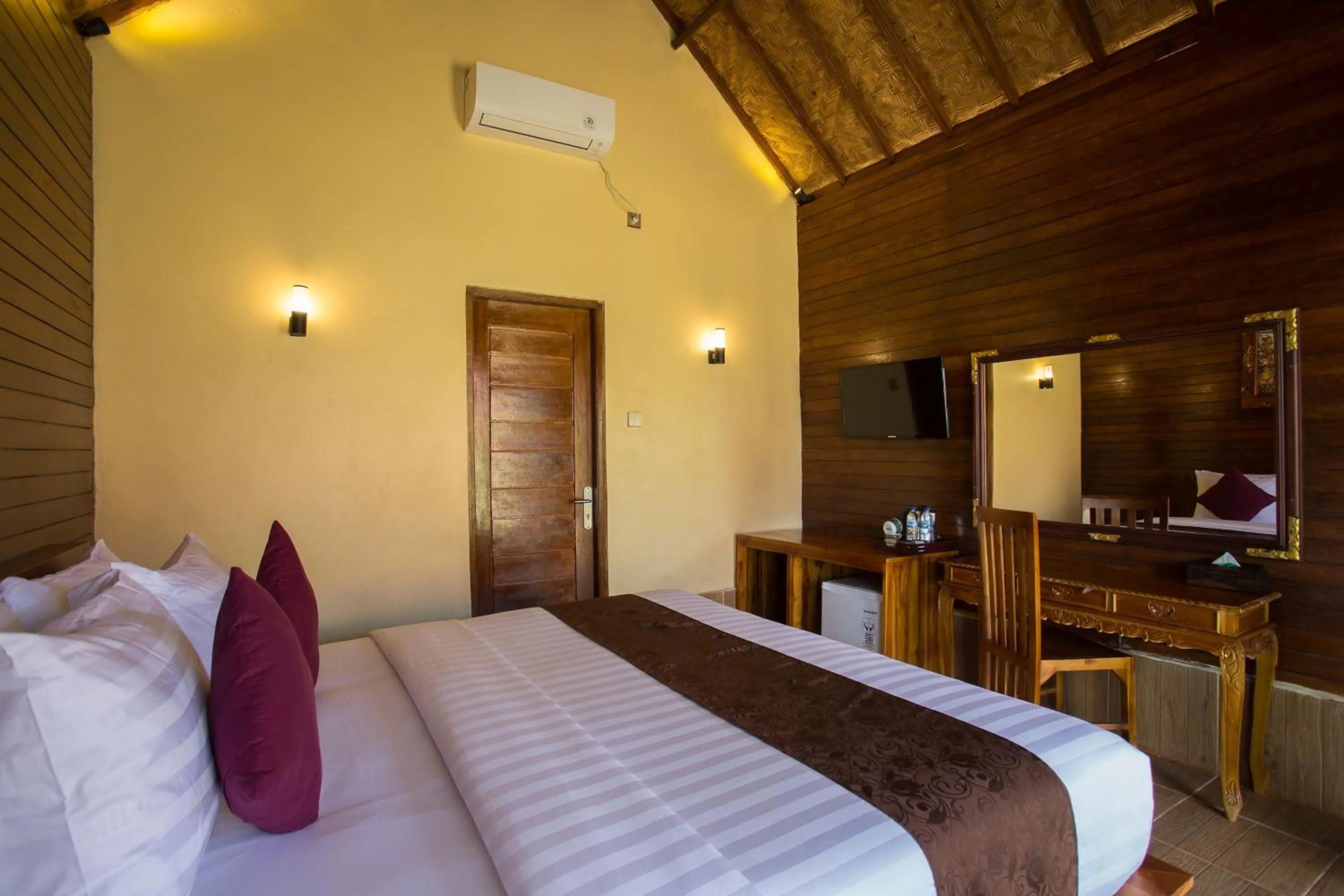 Bed in Rijet Villa Beach & Restaurant