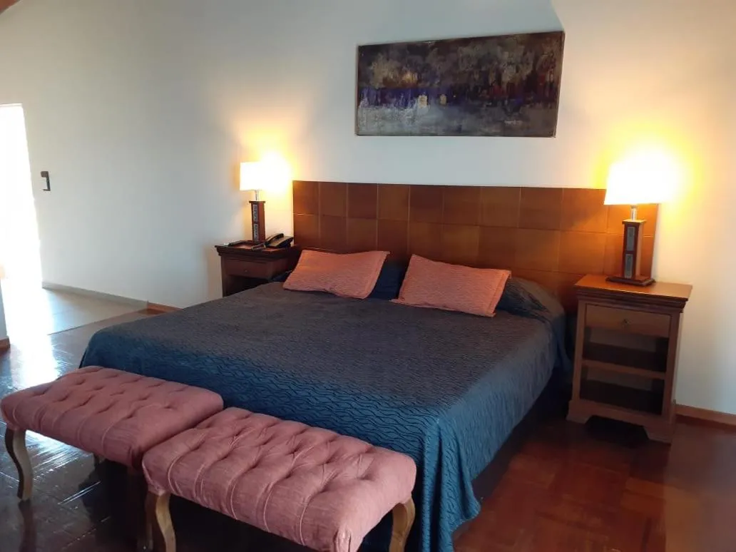 Bed in Tagore Suites Hotel