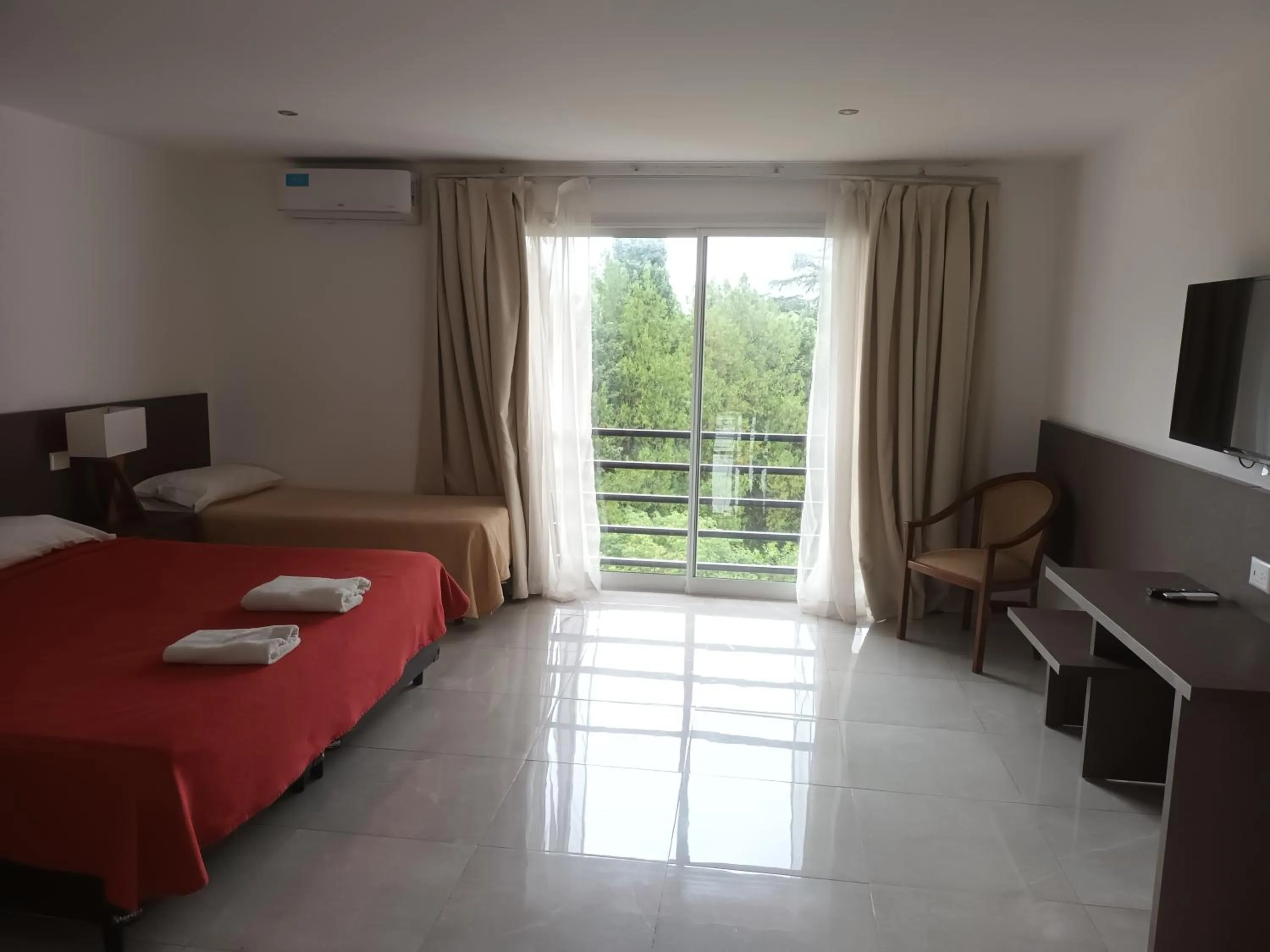 Bed in Tagore Suites Hotel