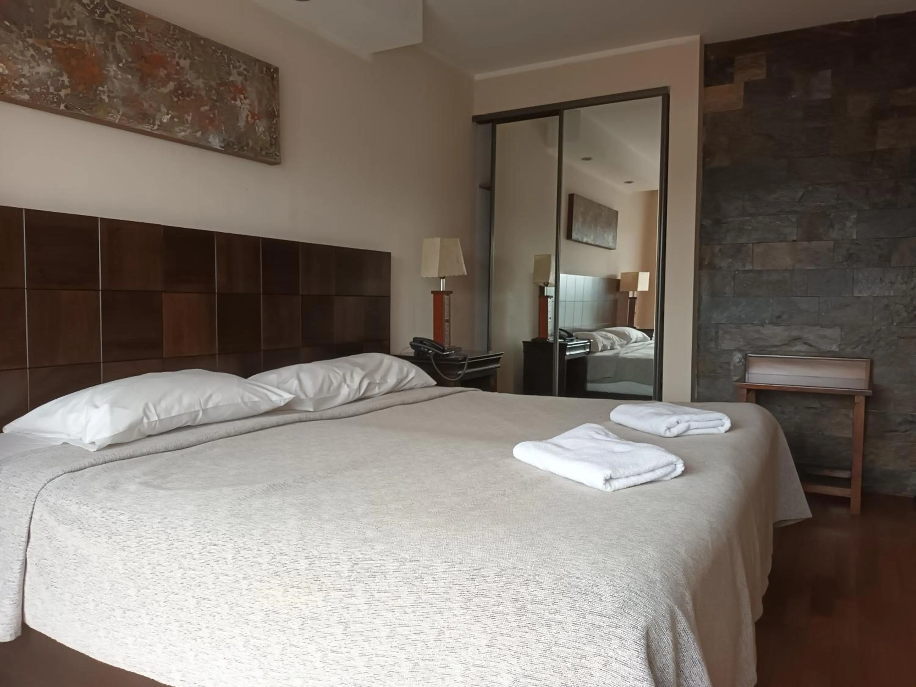 Bed in Tagore Suites Hotel