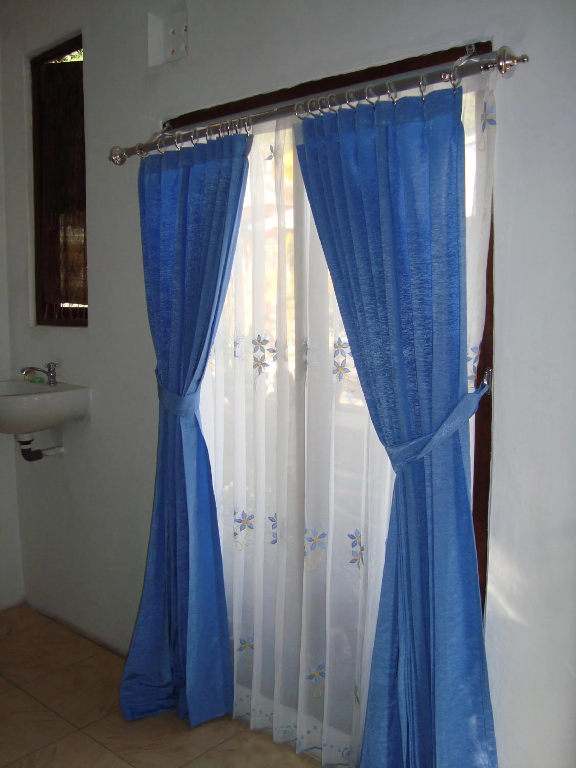 Bedroom in Taman Ayu Homestay Munduk Mitra RedDoorz