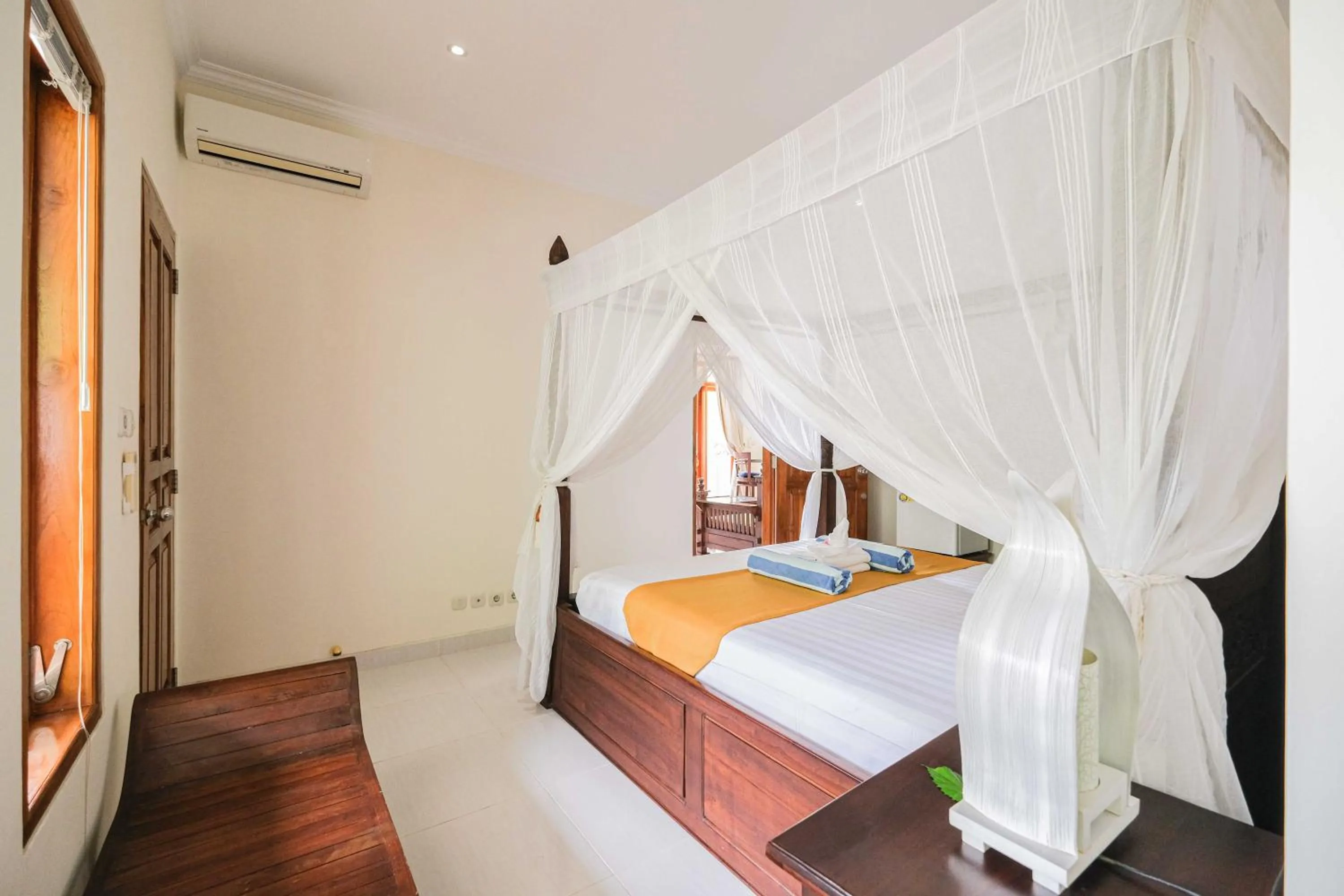 Bed in Poinciana Resort