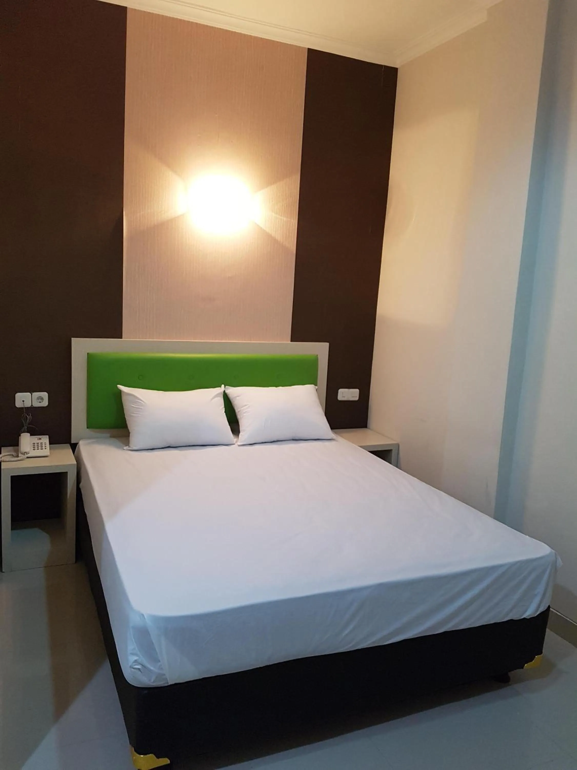 Bed in Ethan Hotel Kelapa Gading