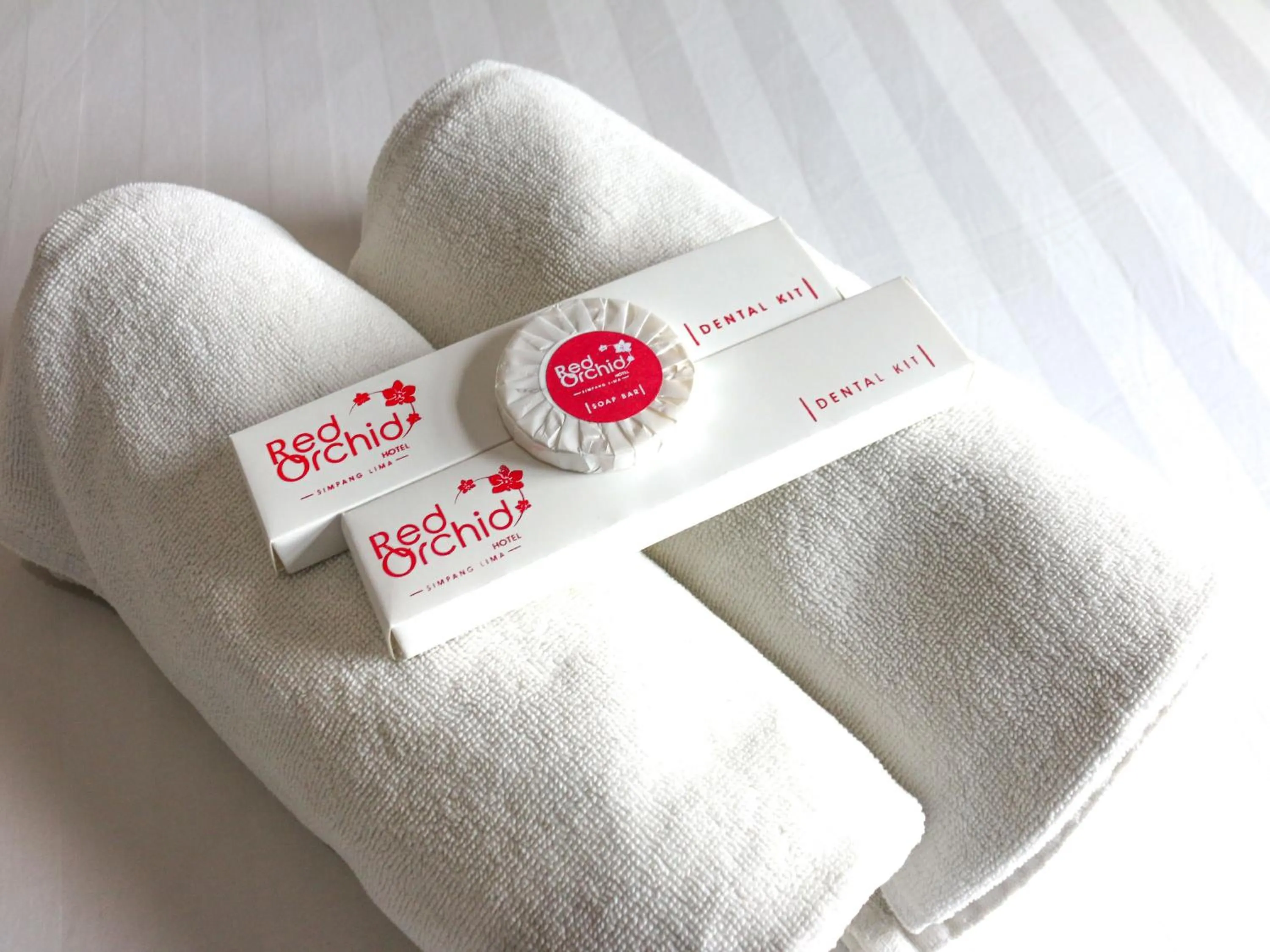 Bed in Red Orchid Hotel by Sajiwa