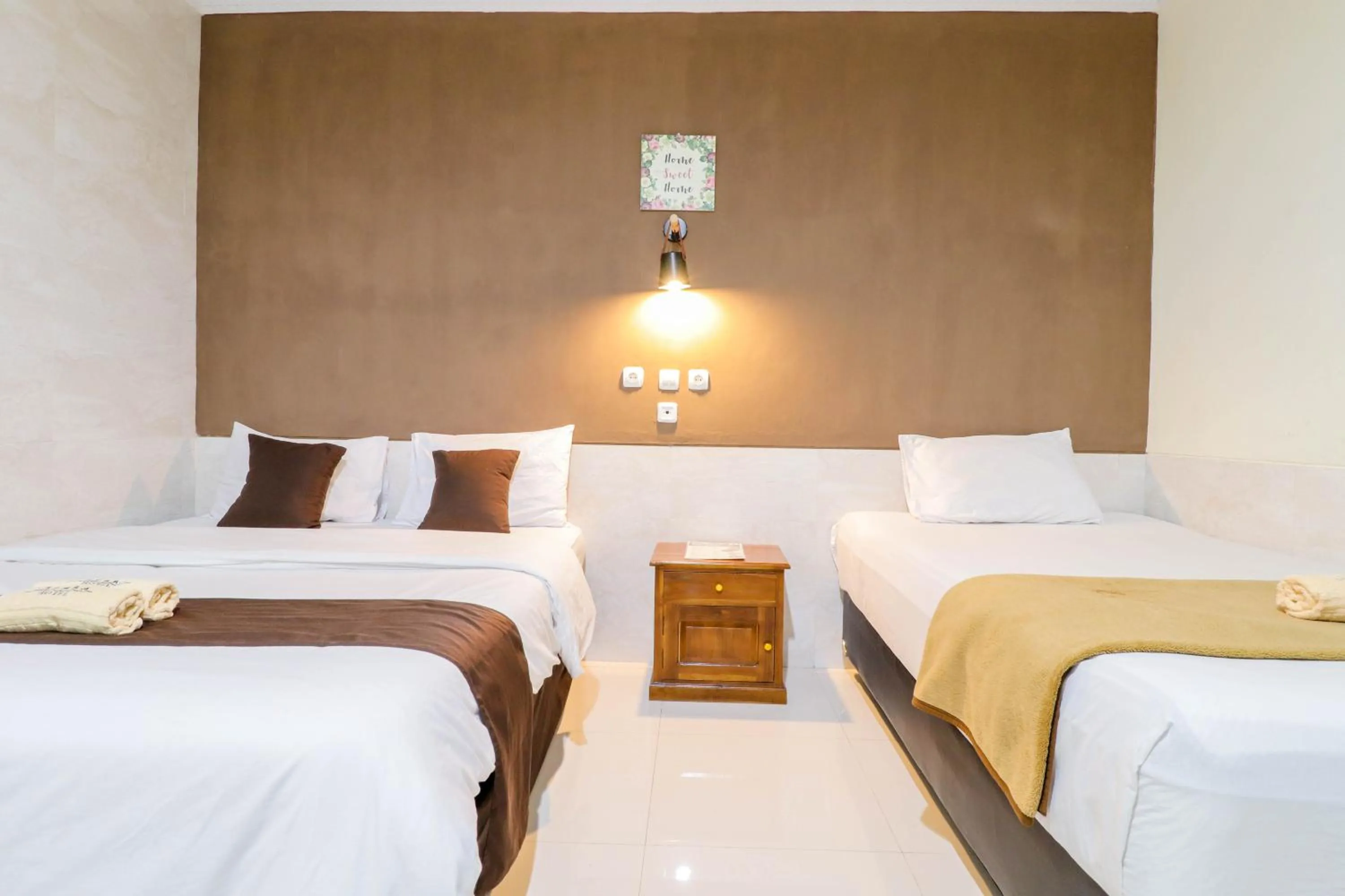Bed in Hotel Safara Yogyakarta