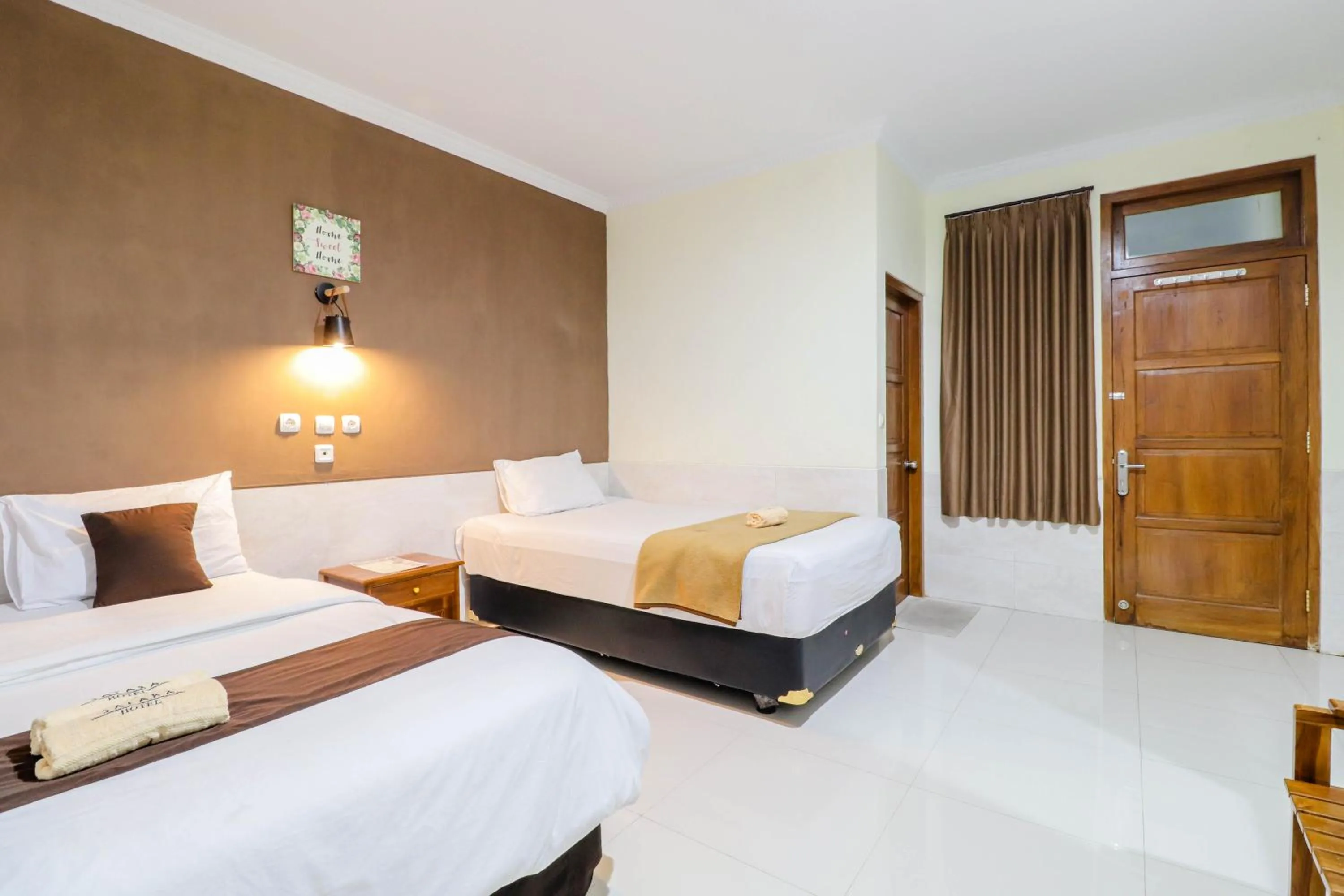 Bed in Hotel Safara Yogyakarta