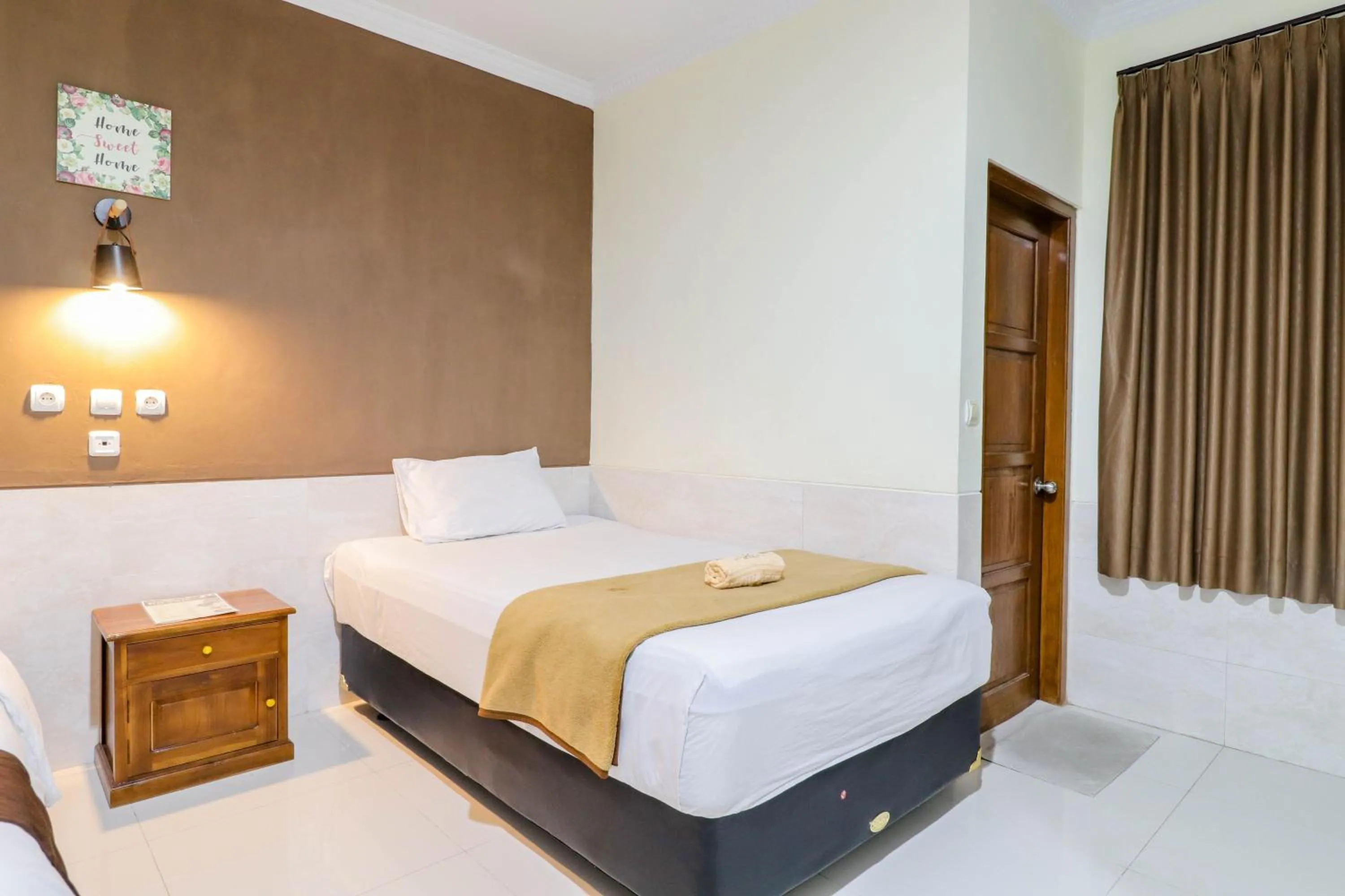 Bed in Hotel Safara Yogyakarta