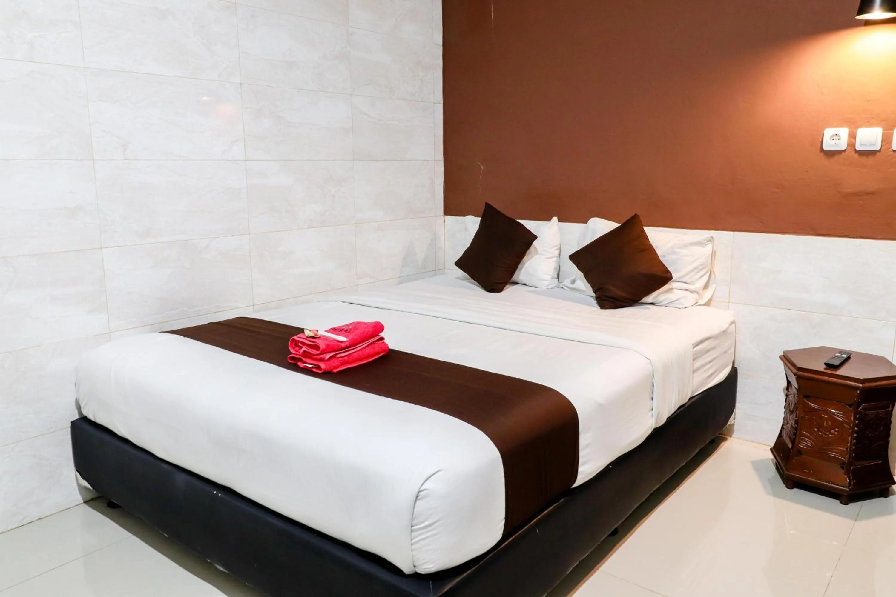 Bed in Hotel Safara Yogyakarta