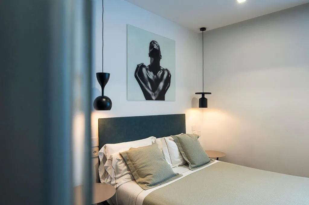 Photo of the whole room, Bed in HOTIDAY Olbia Wallure