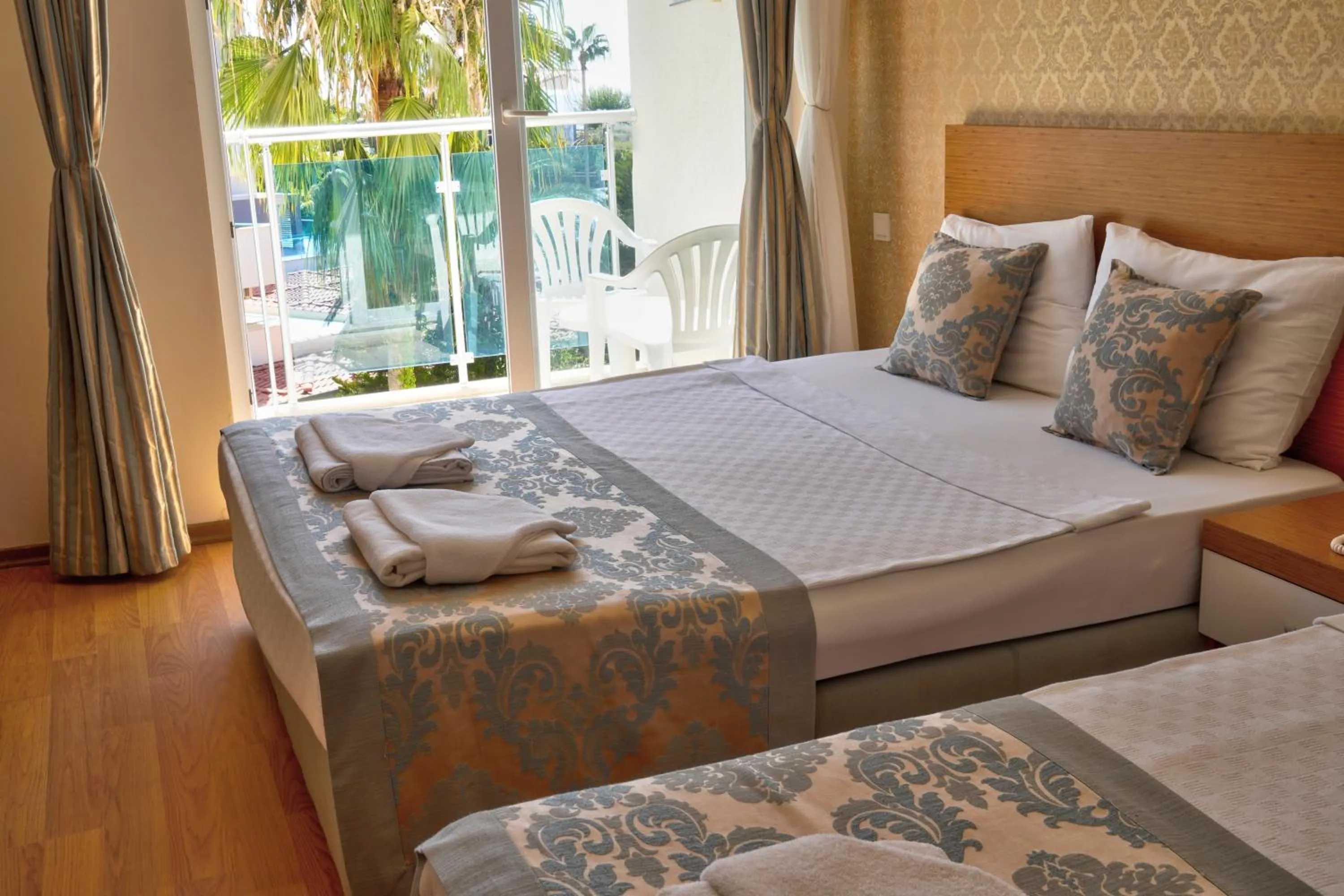 Bed in Blue Fish Hotel All Inclusive