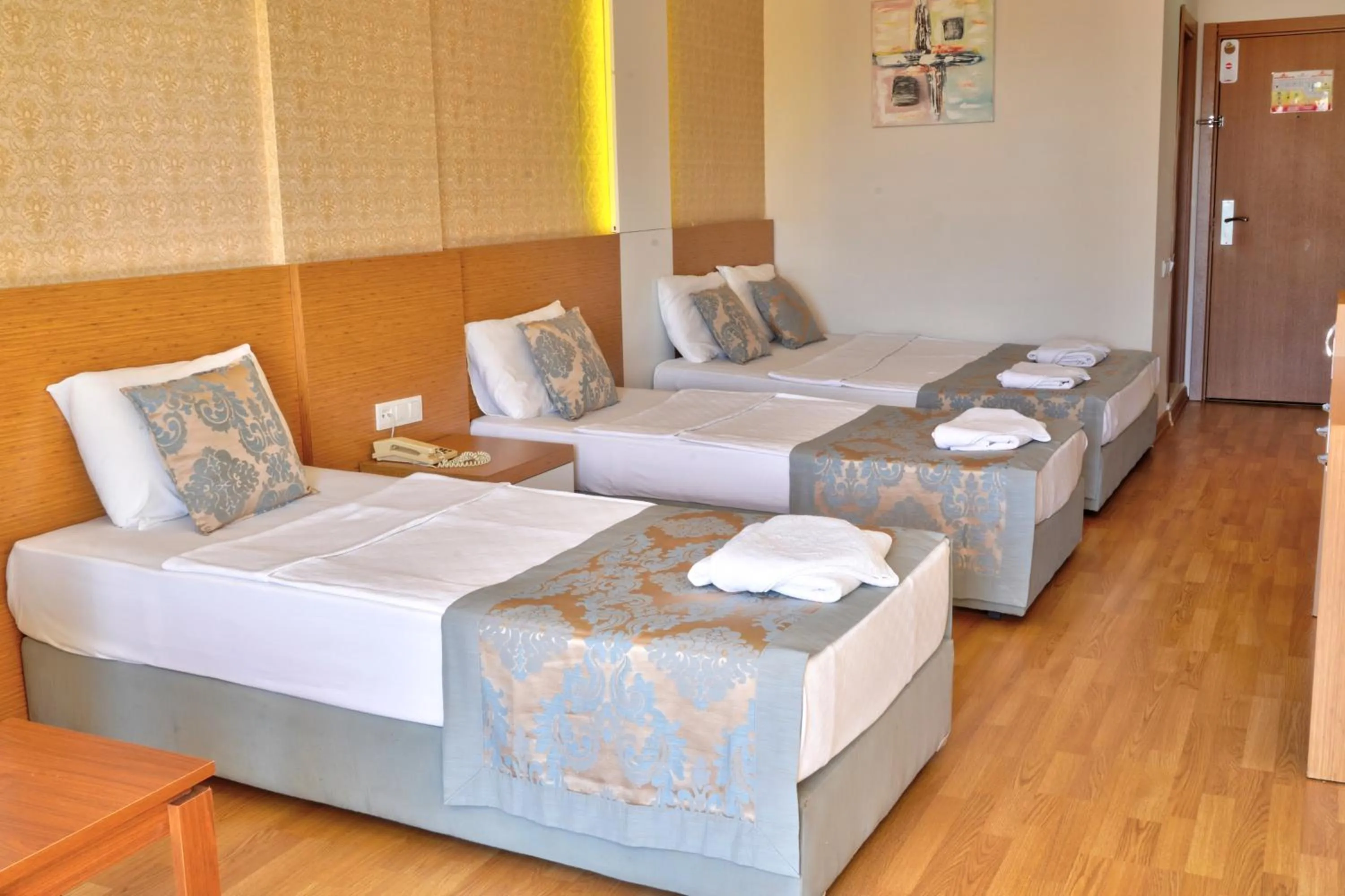 Bed in Blue Fish Hotel All Inclusive