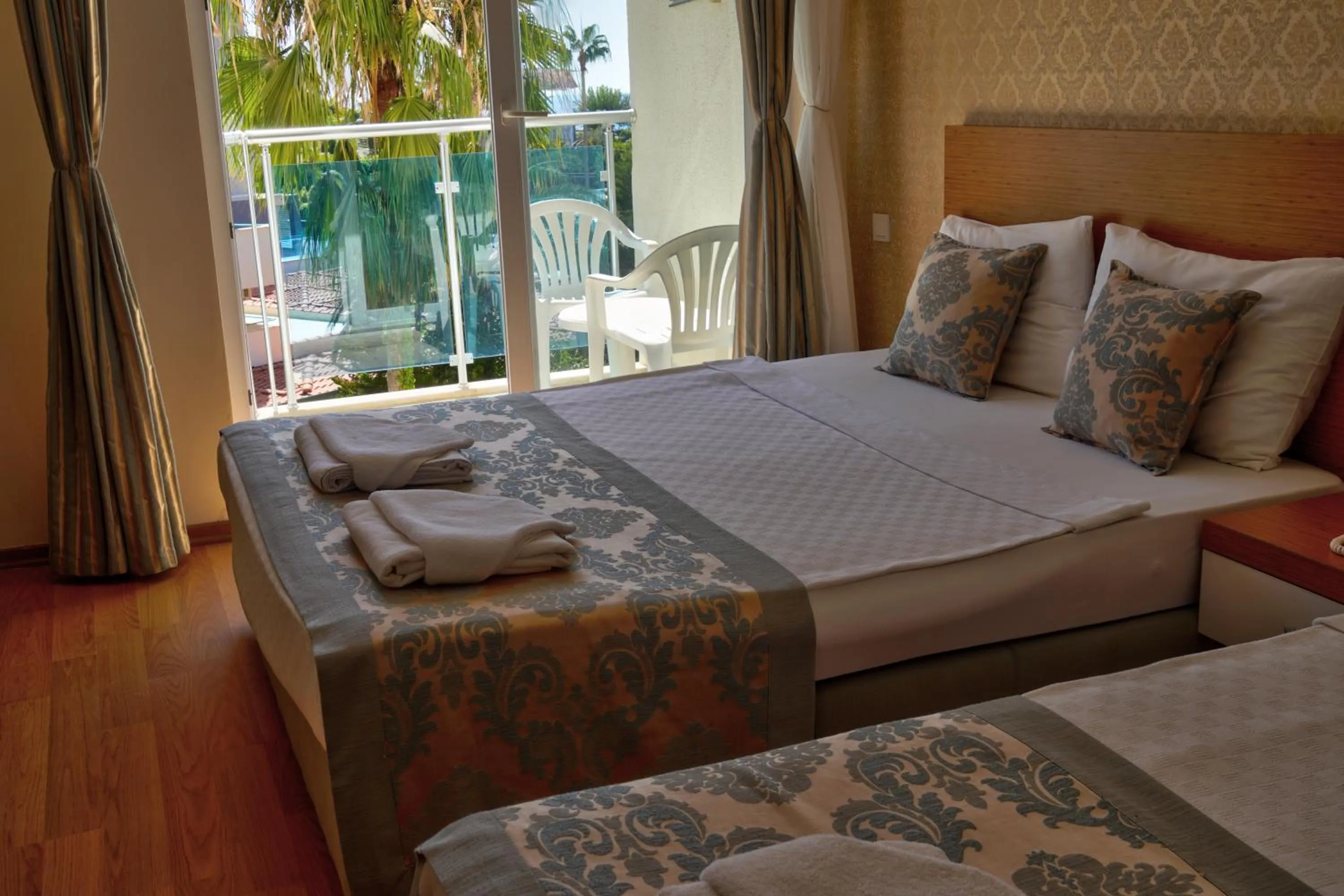 Bed in Blue Fish Hotel All Inclusive